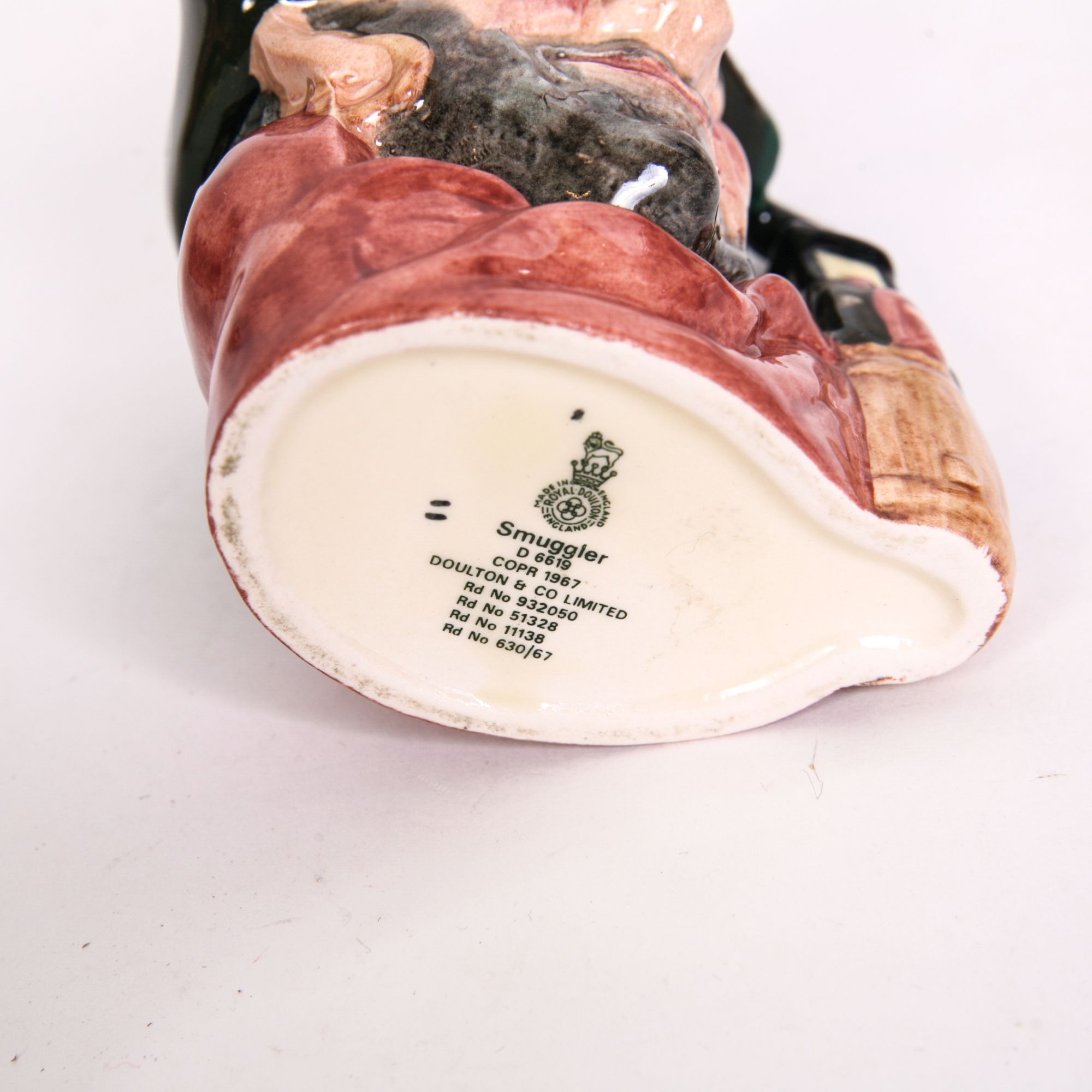 Royal Doulton "Smuggler" D.6616 Toby Jug and D.6619 Mug