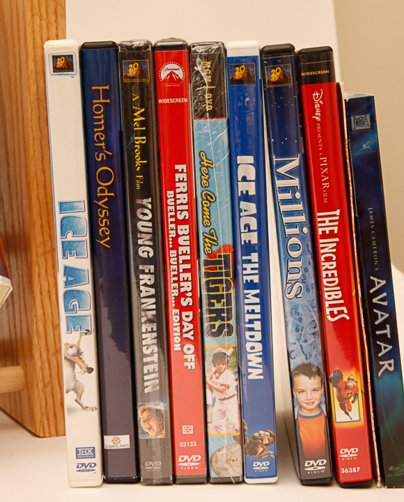 VHS Tapes, DVDs and Wooden Stand