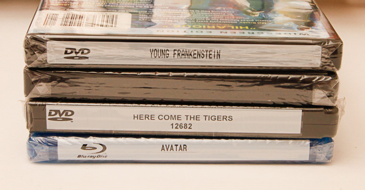 VHS Tapes, DVDs and Wooden Stand