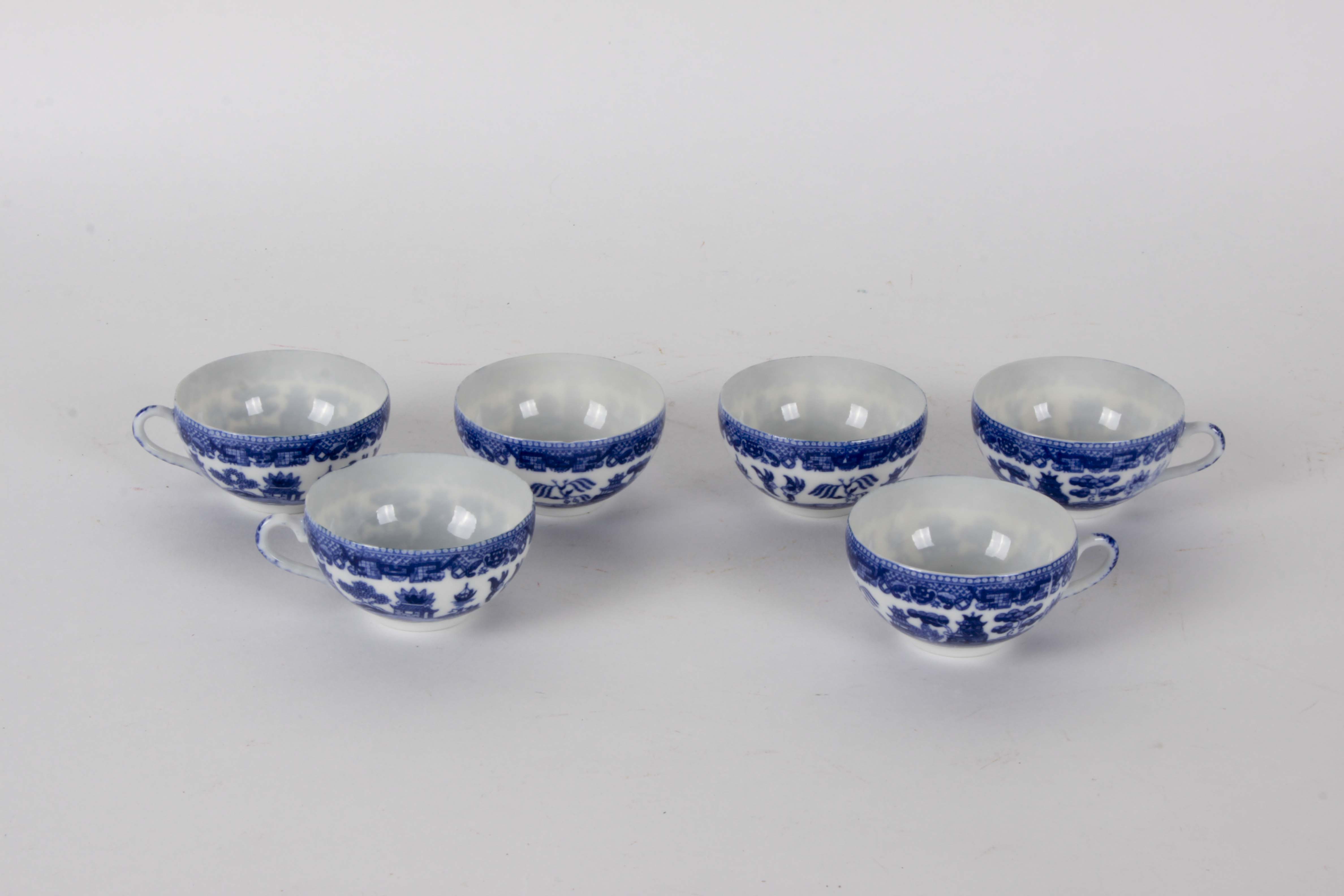 Teacup and Saucer Collection with Lithophane Geisha Impression