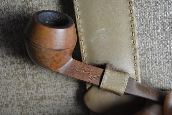 Five Tobacco Pipes On A Stirrup