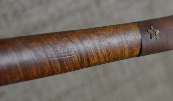 Five Tobacco Pipes On A Stirrup