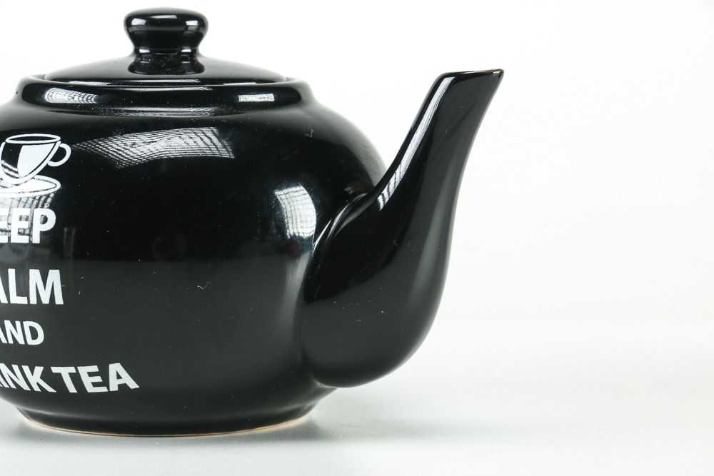 Black Ceramic Teapot and Resin Marine Corps Bear Figurine