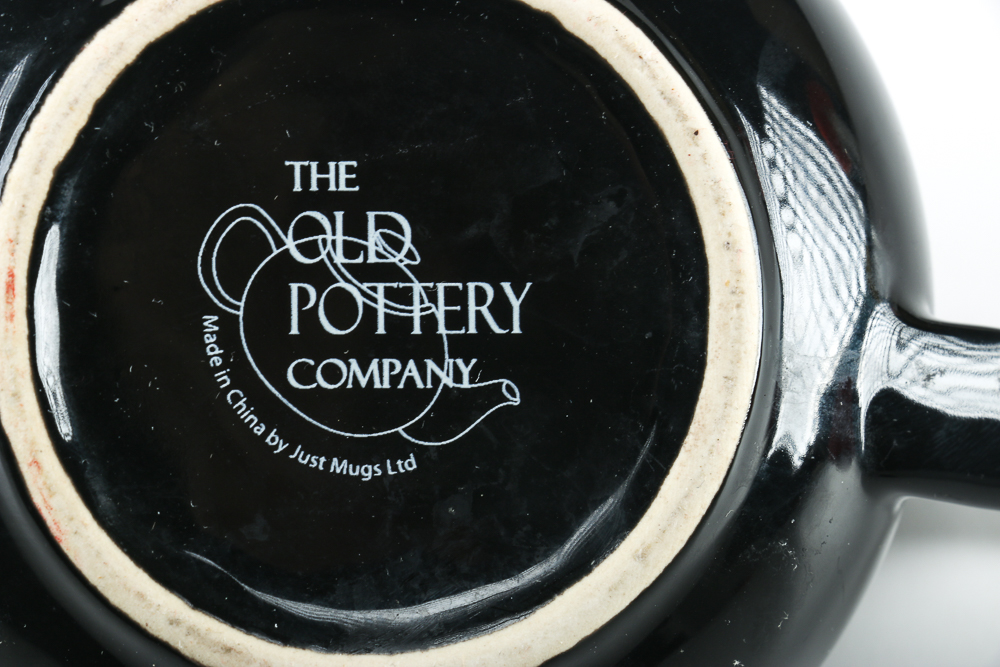 Black Ceramic Teapot and Resin Marine Corps Bear Figurine