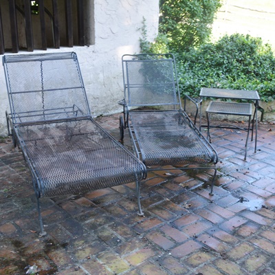 Two Black Metal Patio Chaise Lounge Chairs and Nesting Tables