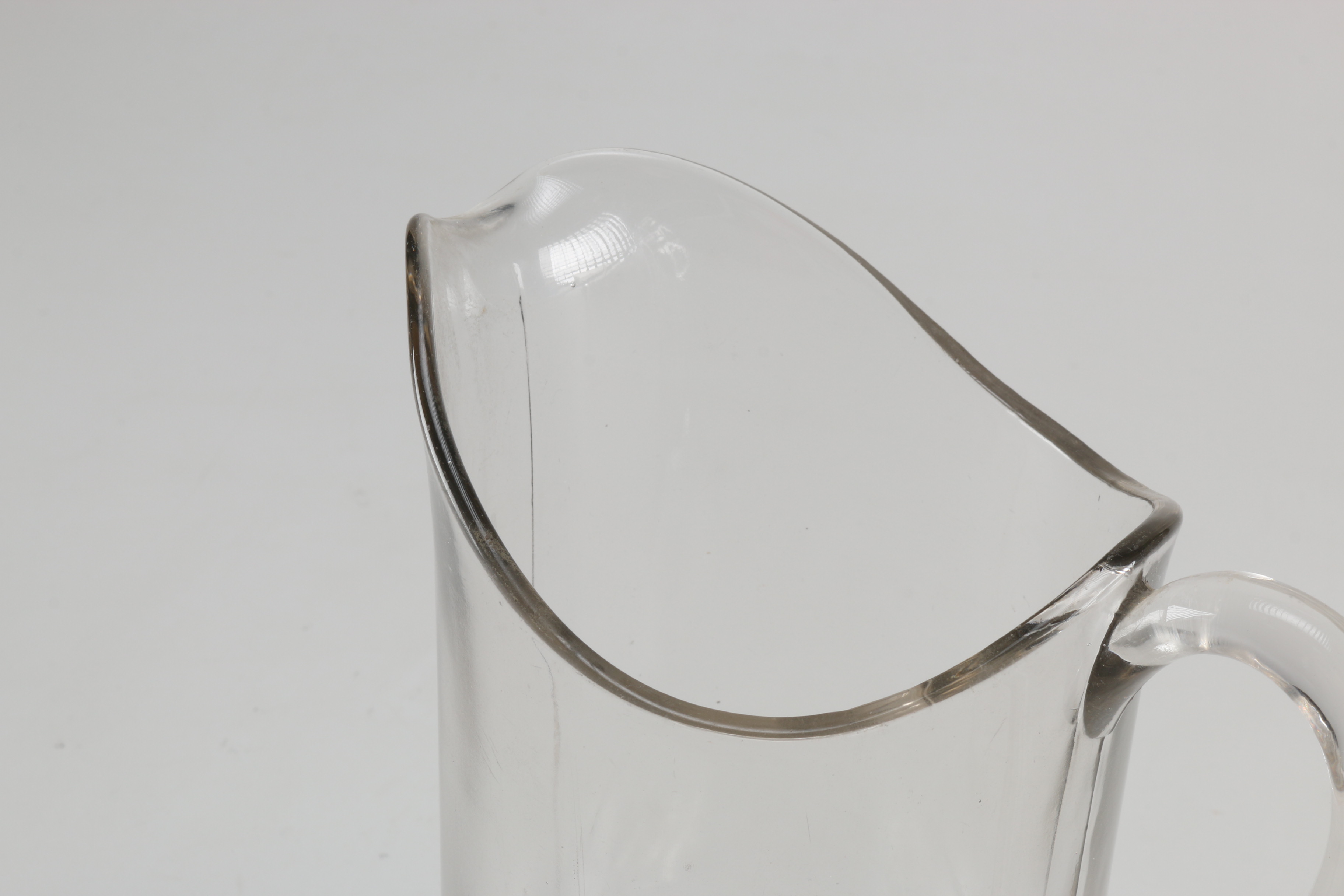 Assortment of Glass Items and Ceramic Pitcher