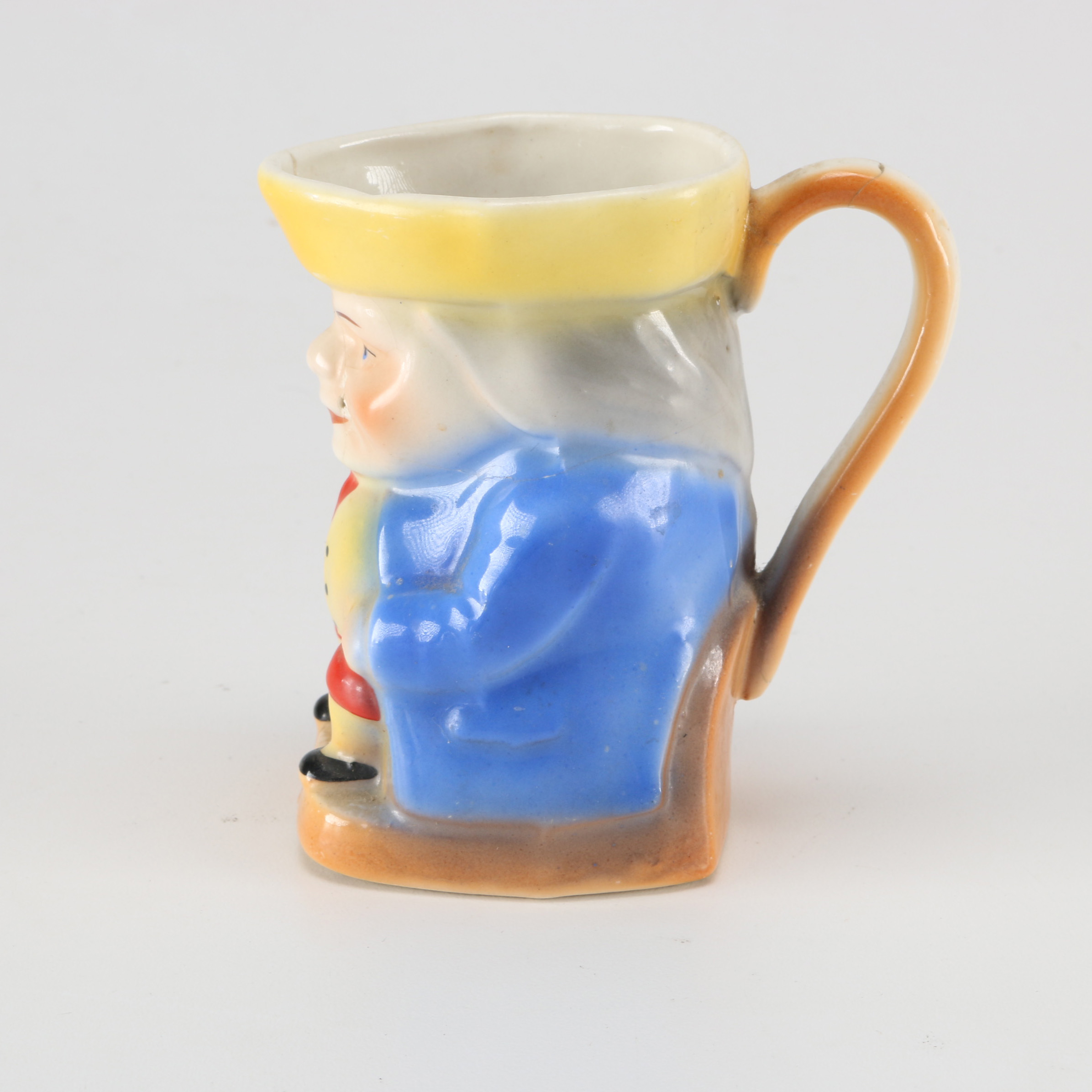 Assortment of Glass Items and Ceramic Pitcher