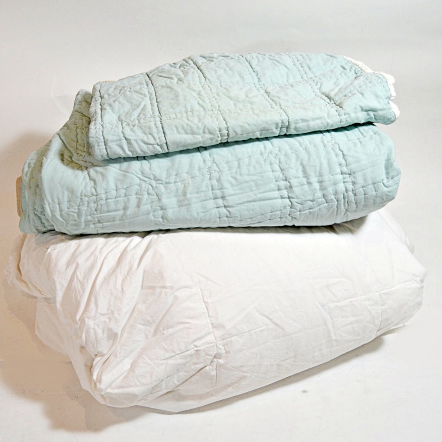 Bed Linens in White and Pale Blue with Down Comforter