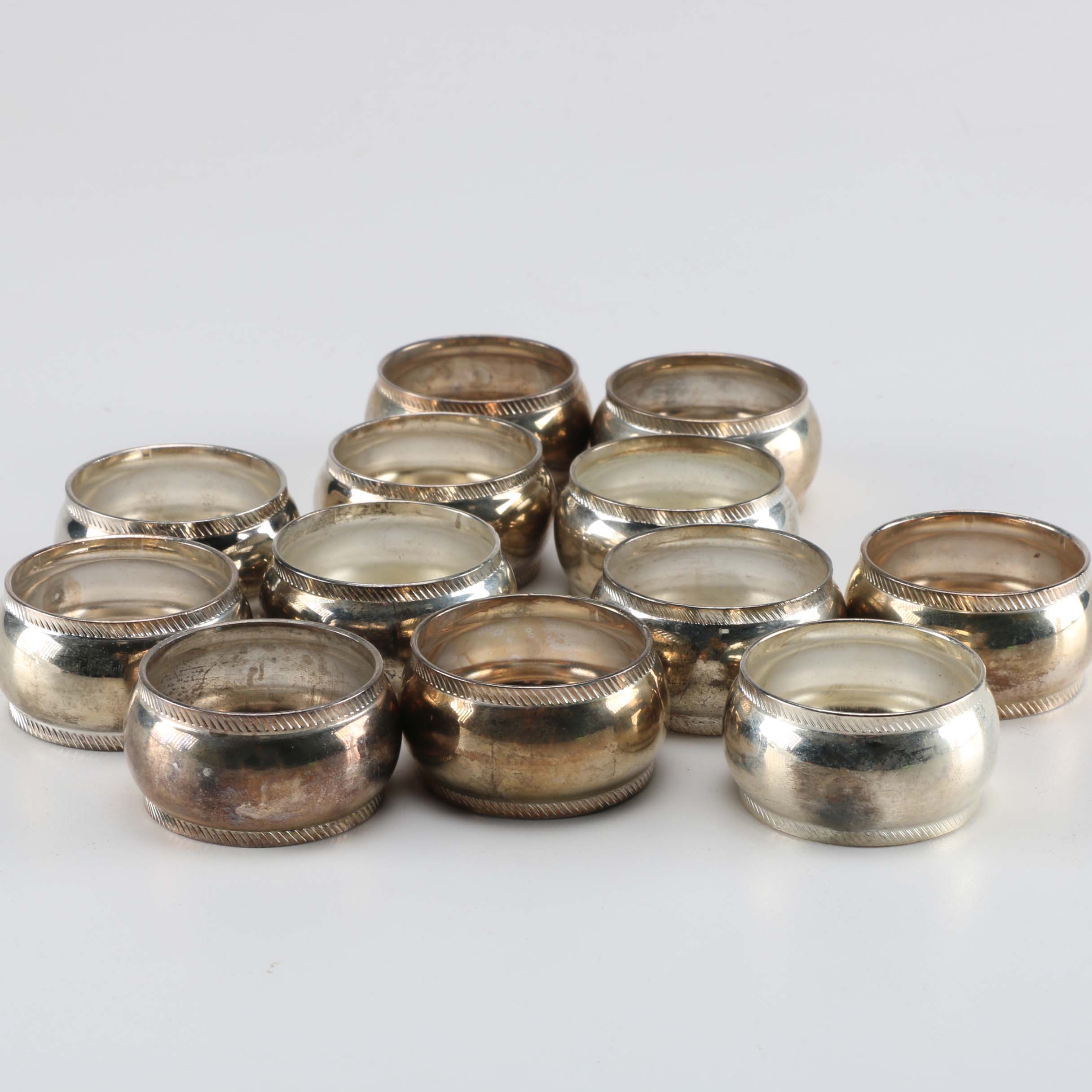 Twelve SIlver Plate Napkin Rings