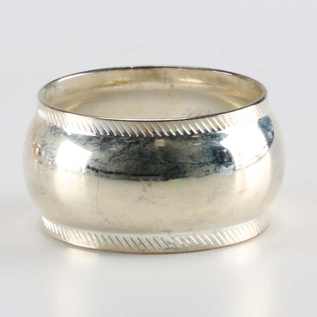 Twelve SIlver Plate Napkin Rings