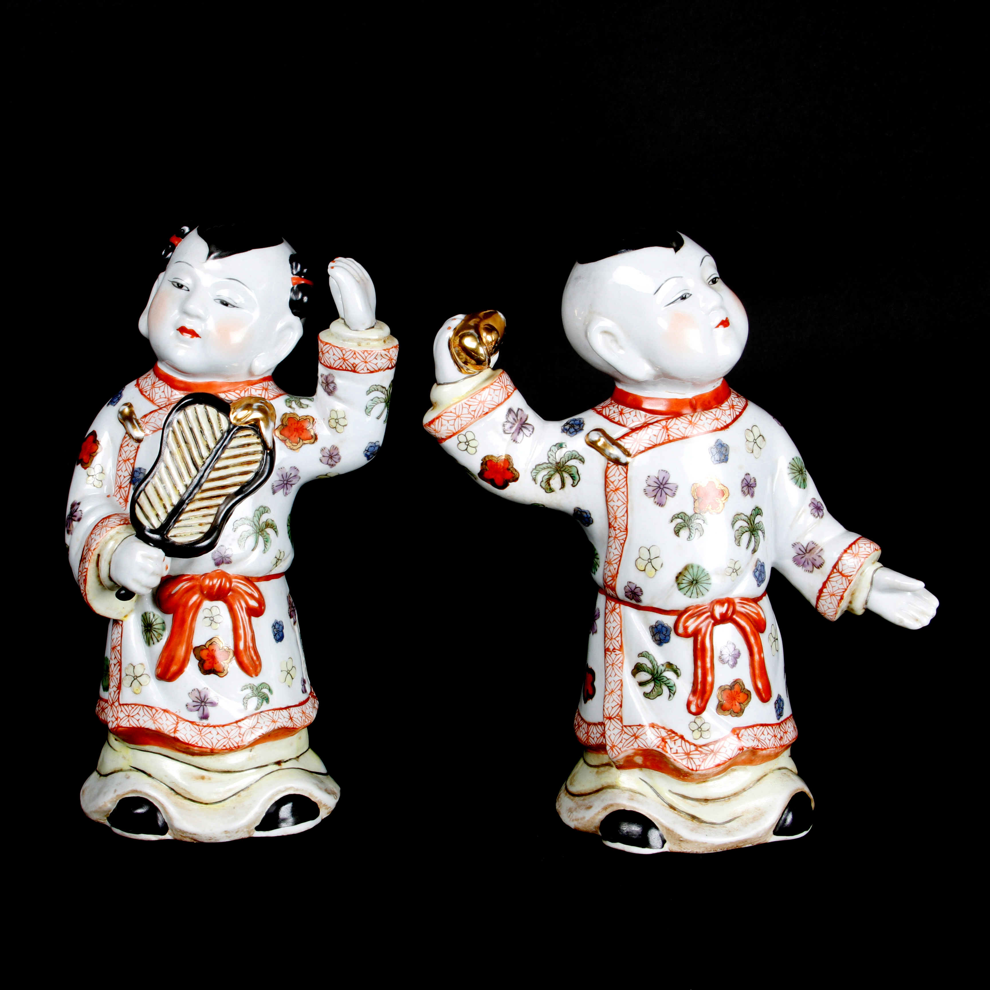 Pair of Chinese Boy and Girl Porcelain Figurines