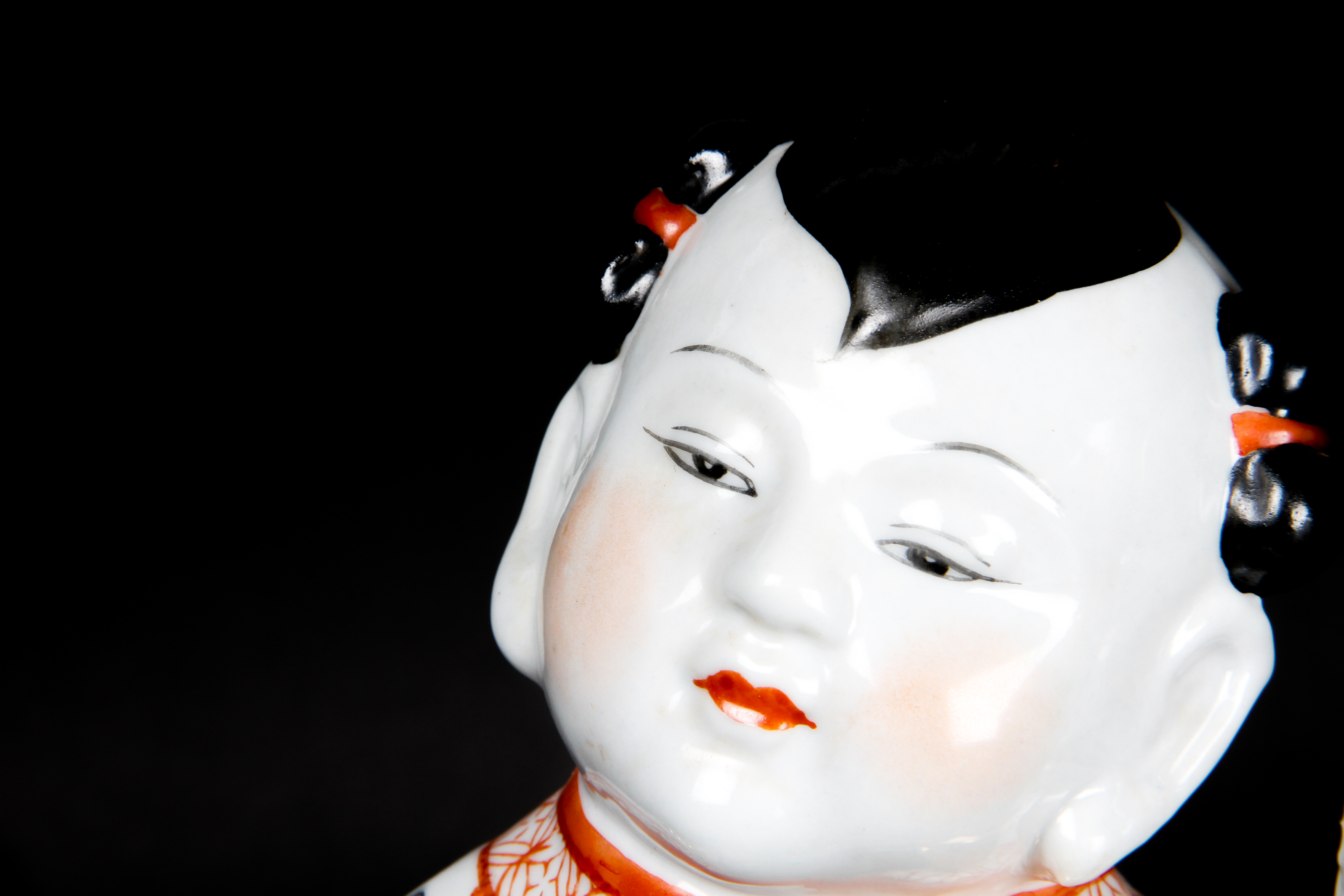 Pair of Chinese Boy and Girl Porcelain Figurines