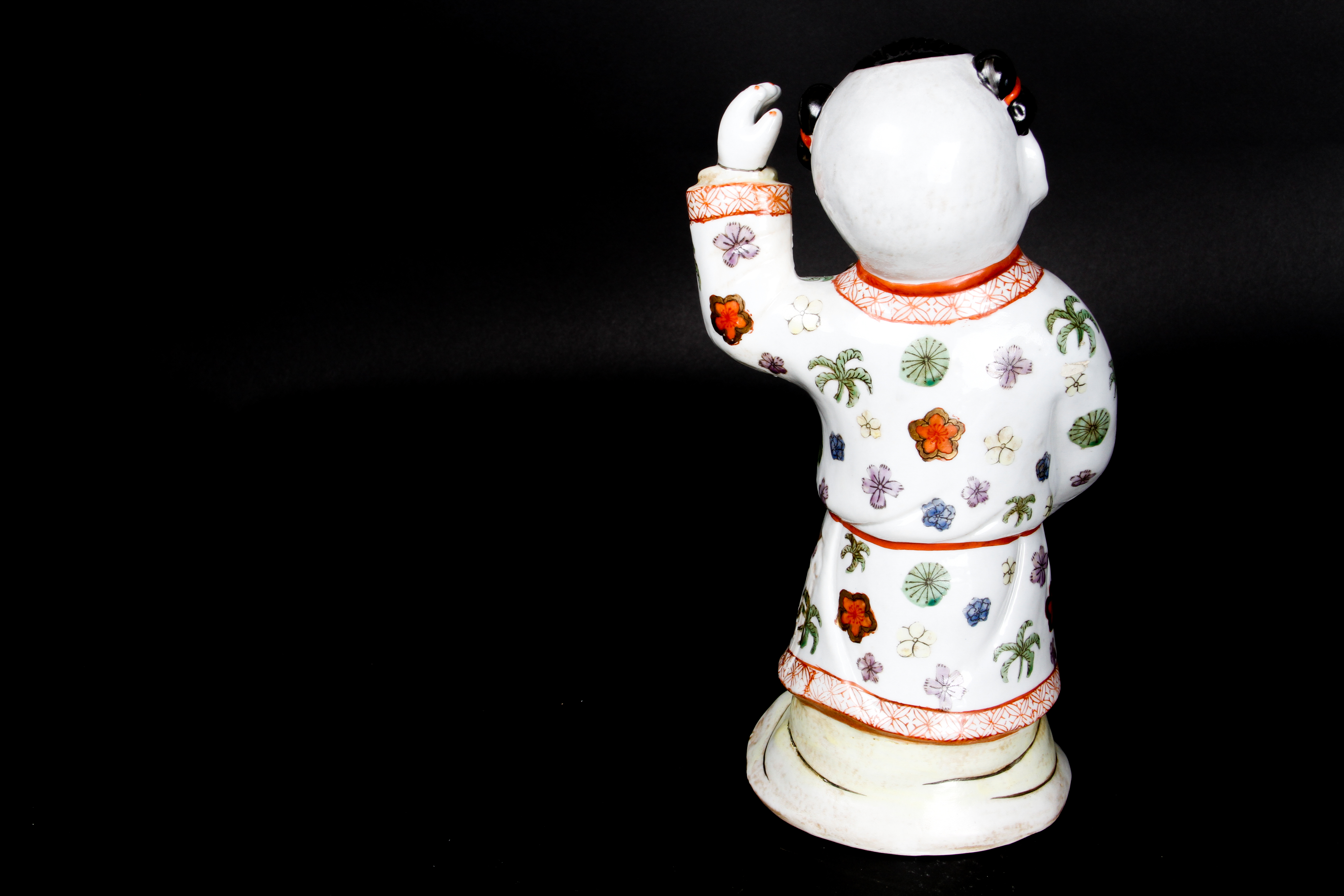 Pair of Chinese Boy and Girl Porcelain Figurines