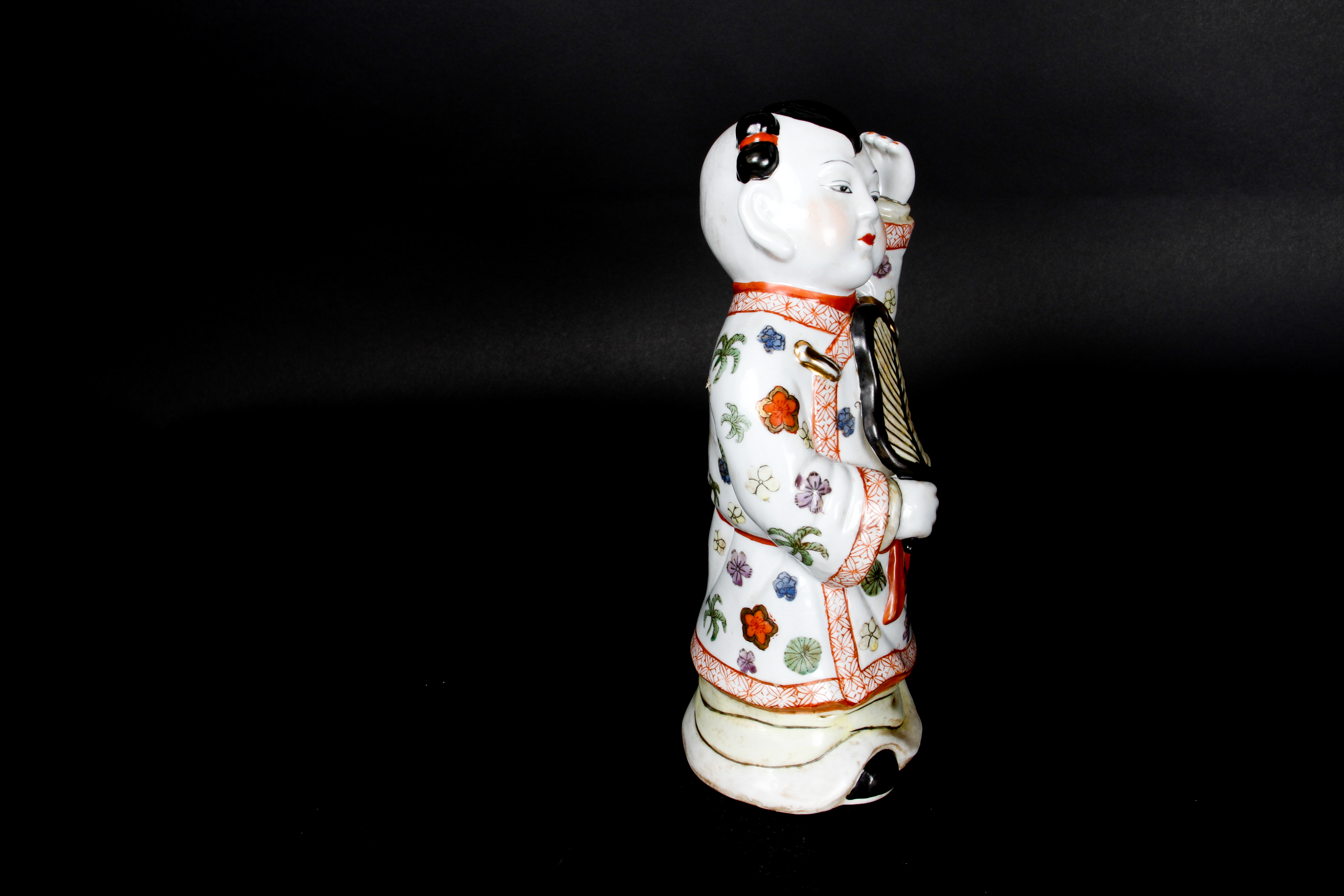 Pair of Chinese Boy and Girl Porcelain Figurines