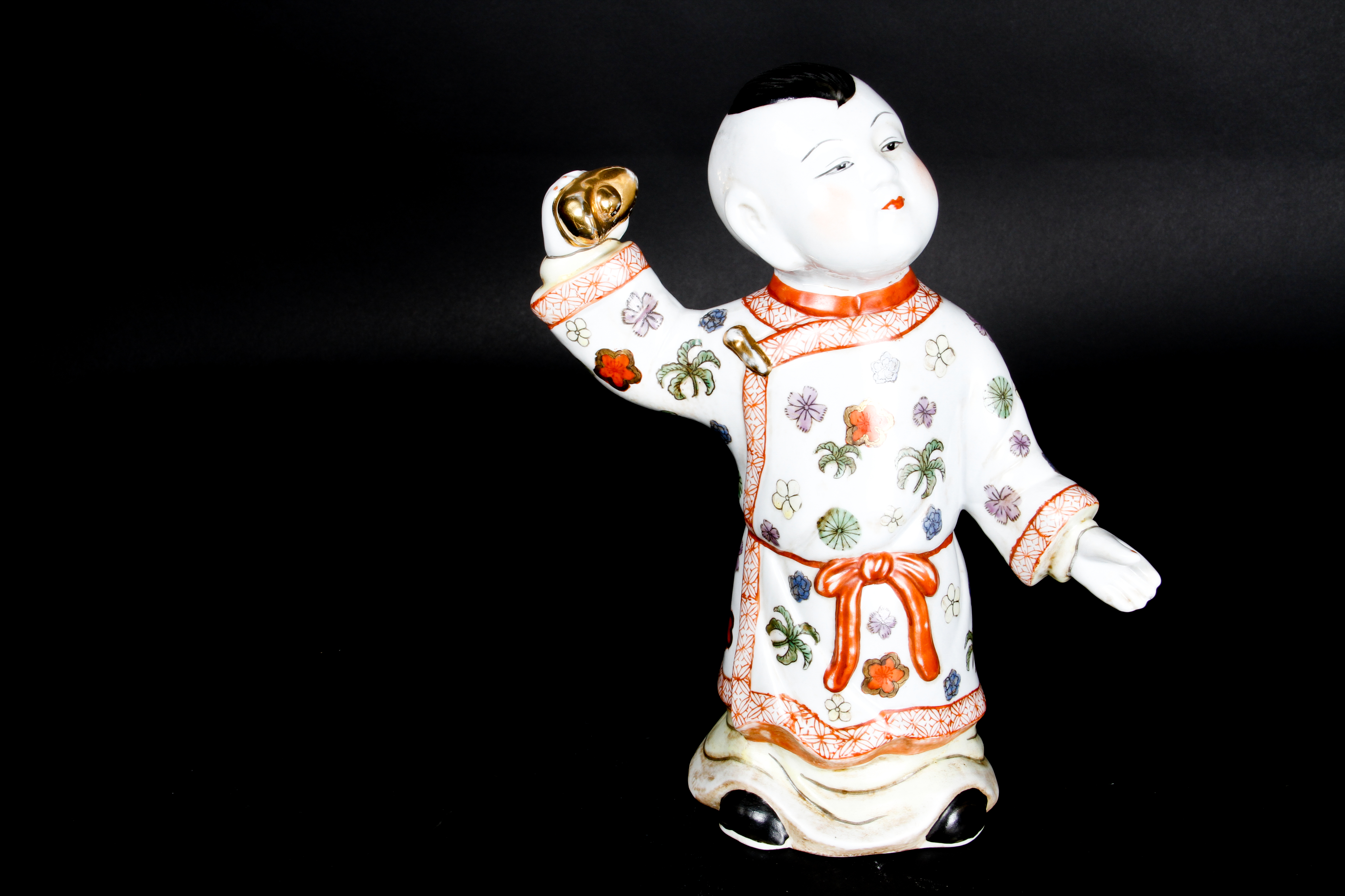 Pair of Chinese Boy and Girl Porcelain Figurines