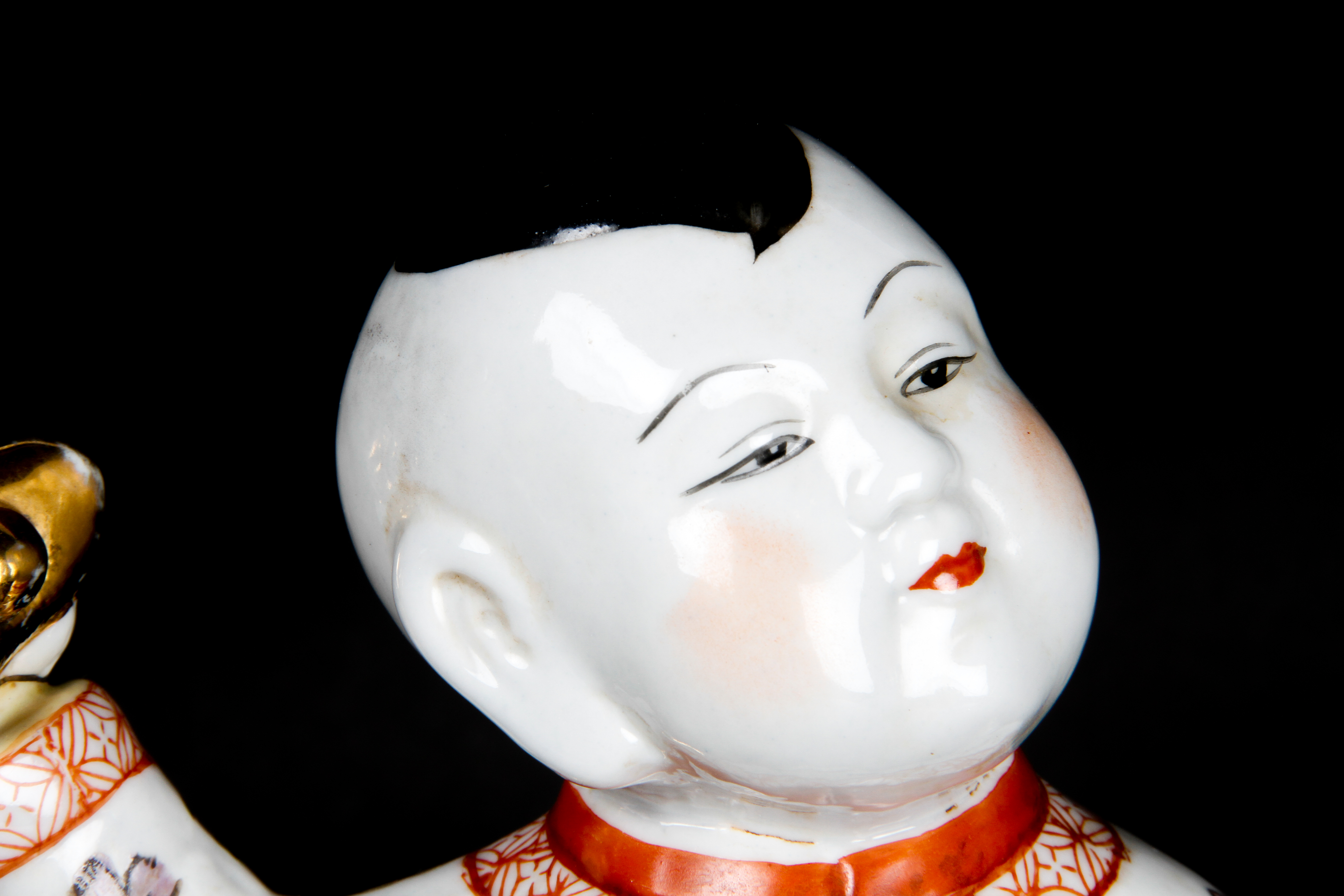 Pair of Chinese Boy and Girl Porcelain Figurines