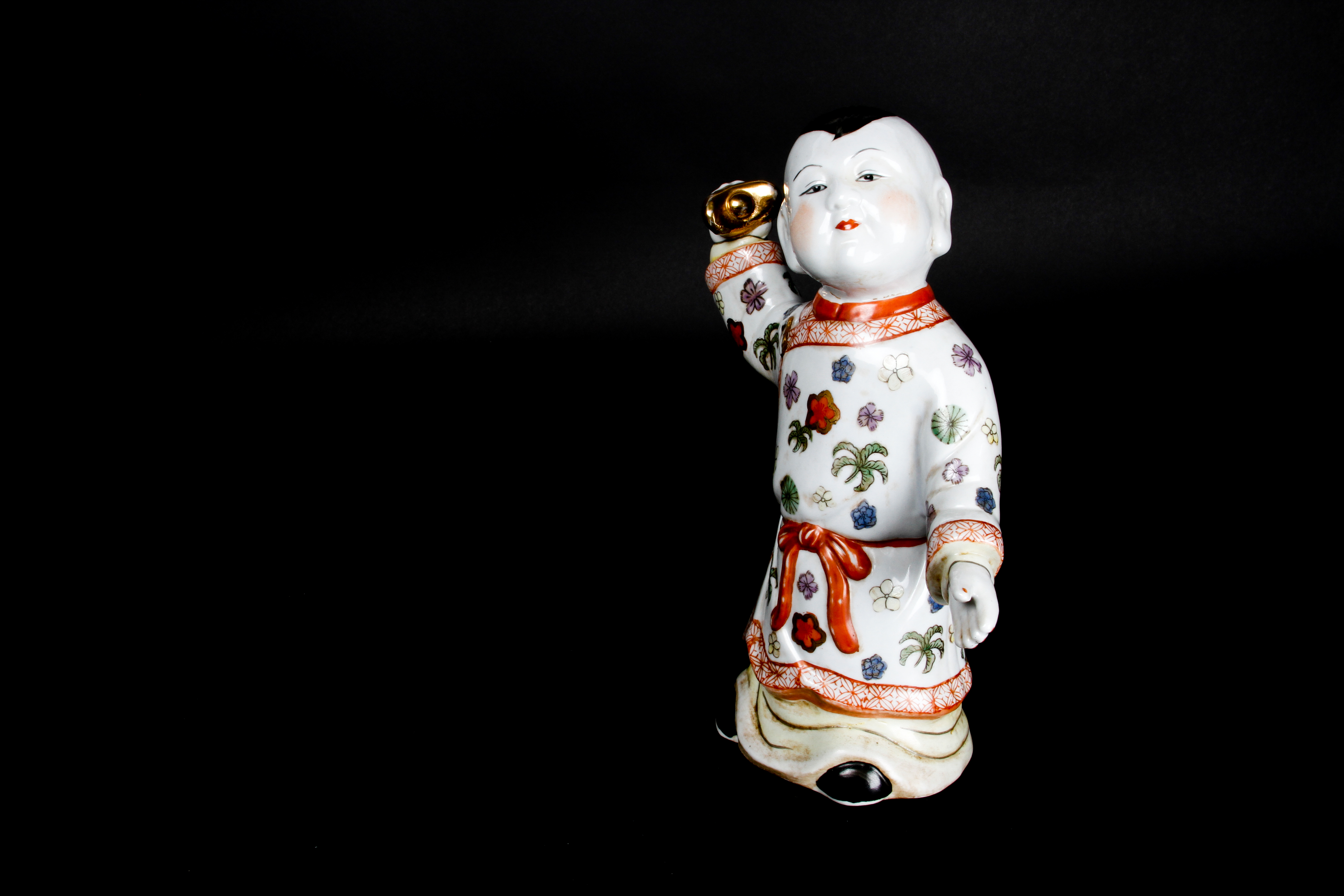 Pair of Chinese Boy and Girl Porcelain Figurines
