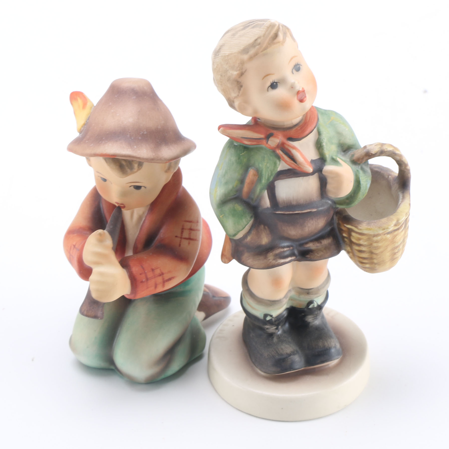 Goebel Hummels "Little Tooter", "Village Boy", "Globe Trotter", and "Lost Sheep"