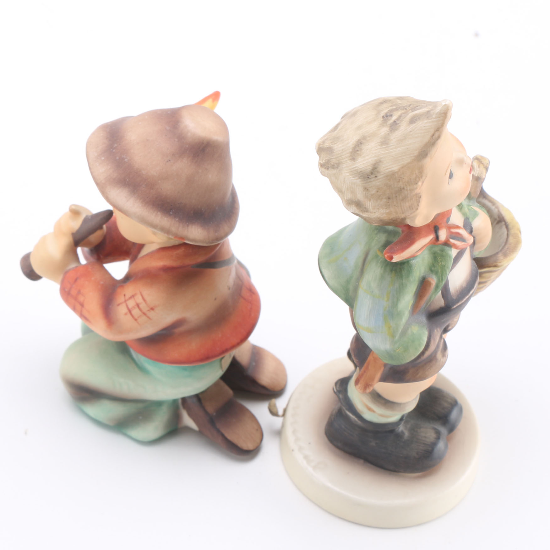 Goebel Hummels "Little Tooter", "Village Boy", "Globe Trotter", and "Lost Sheep"