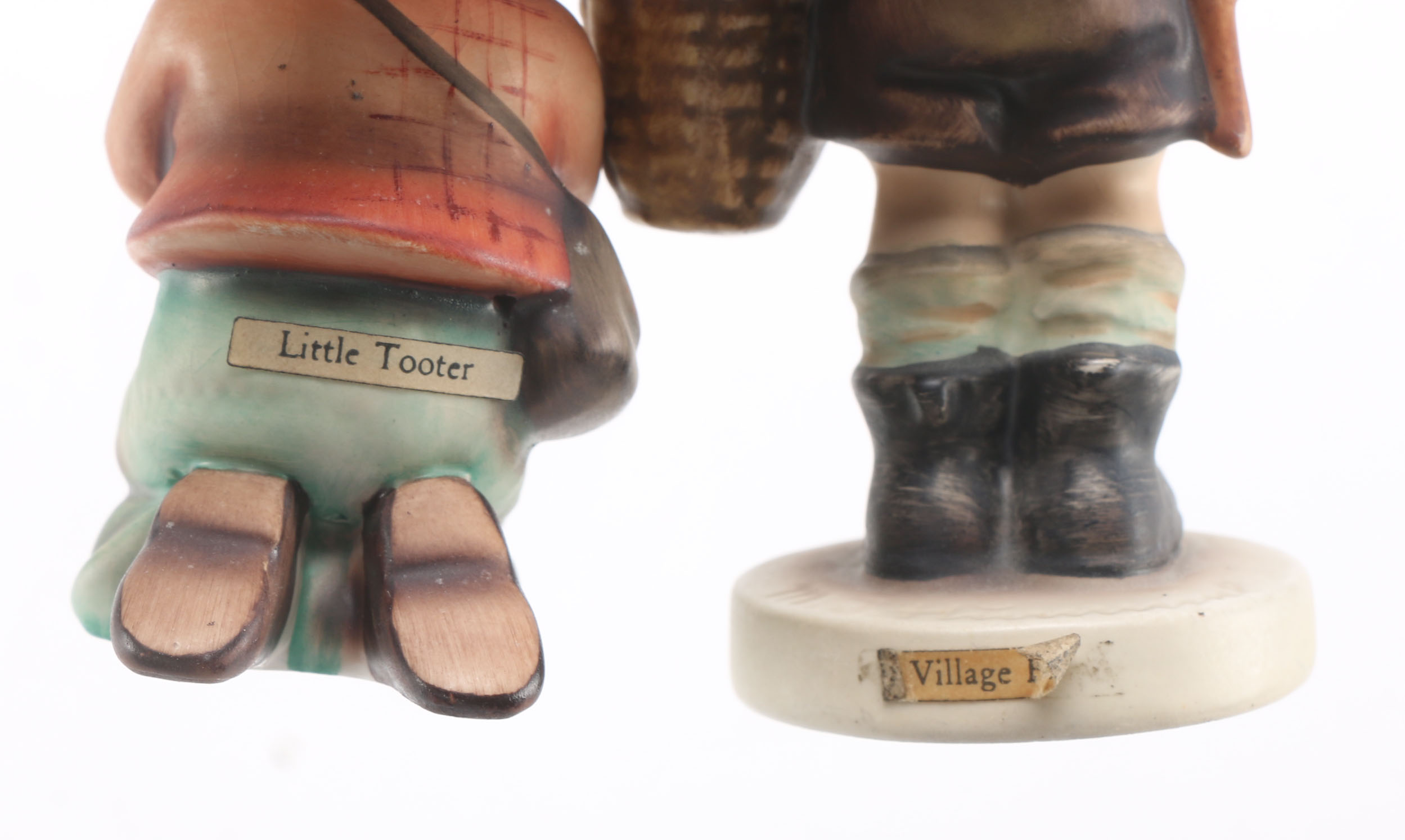 Goebel Hummels "Little Tooter", "Village Boy", "Globe Trotter", and "Lost Sheep"