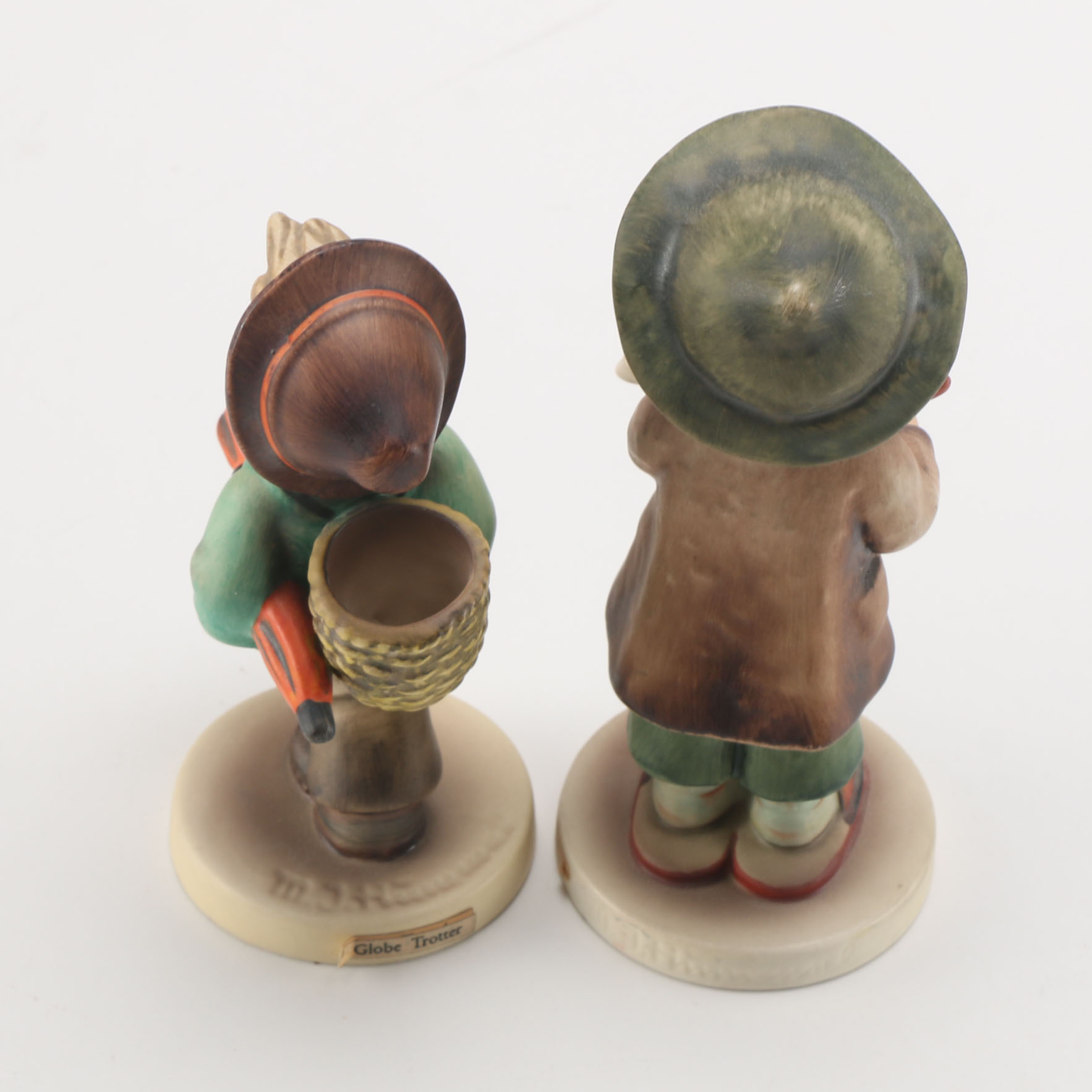 Goebel Hummels "Little Tooter", "Village Boy", "Globe Trotter", and "Lost Sheep"