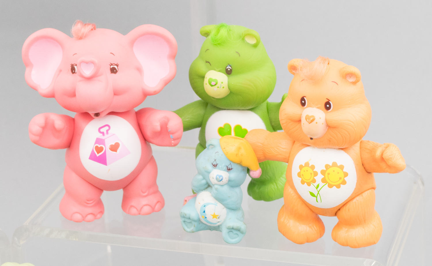 Dozens of Vintage Care Bears Posable Figurines and Cloud Car