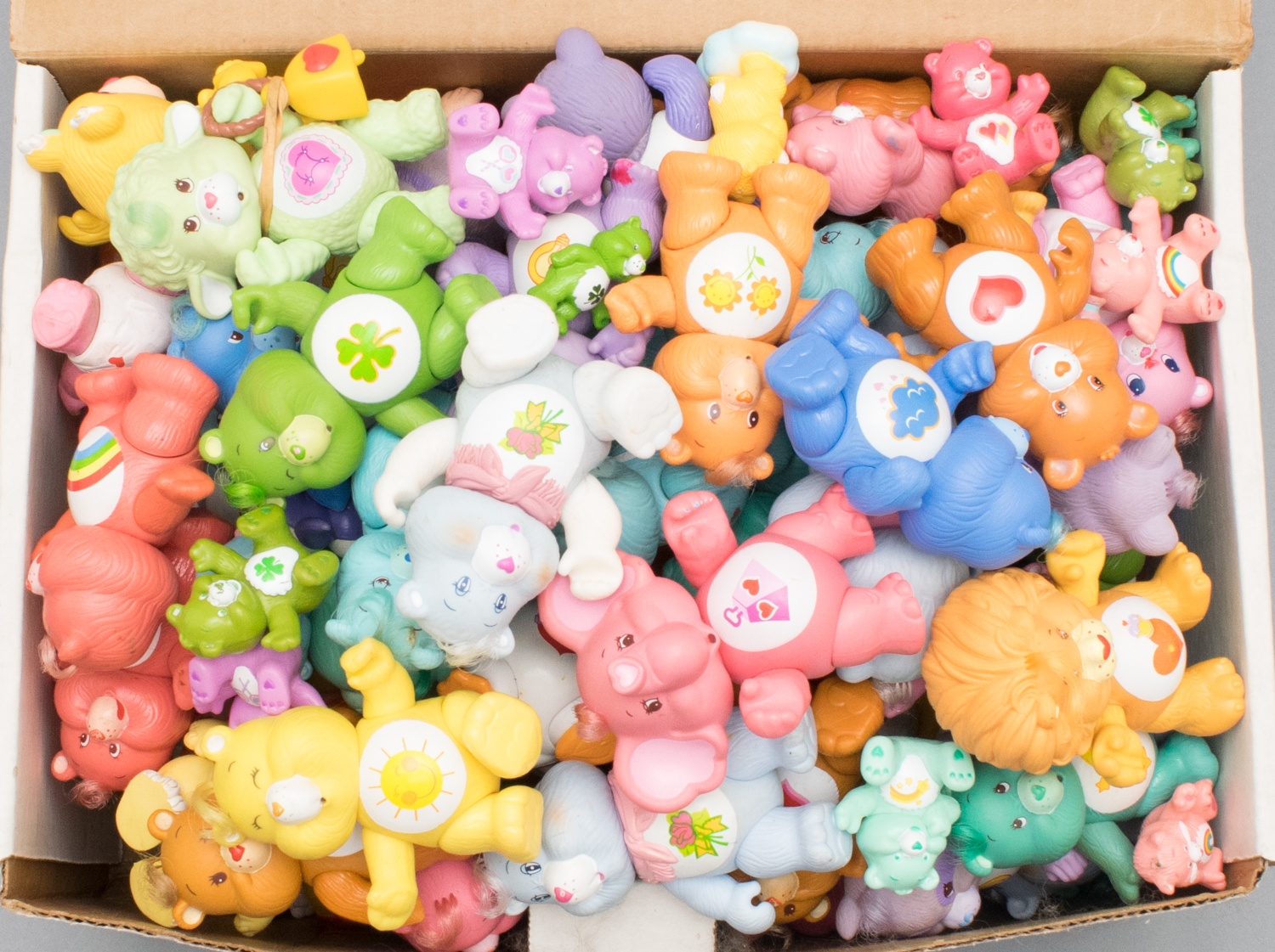 Dozens of Vintage Care Bears Posable Figurines and Cloud Car