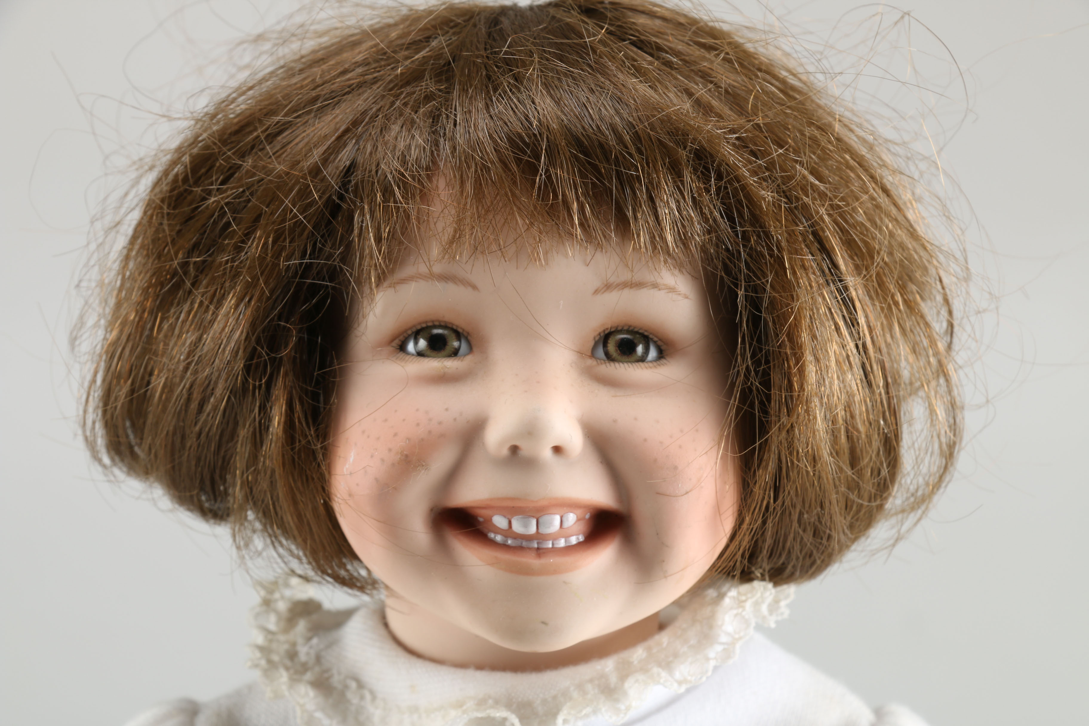 Brown Haired Porcelain Doll with Minnie Mouse Clothing