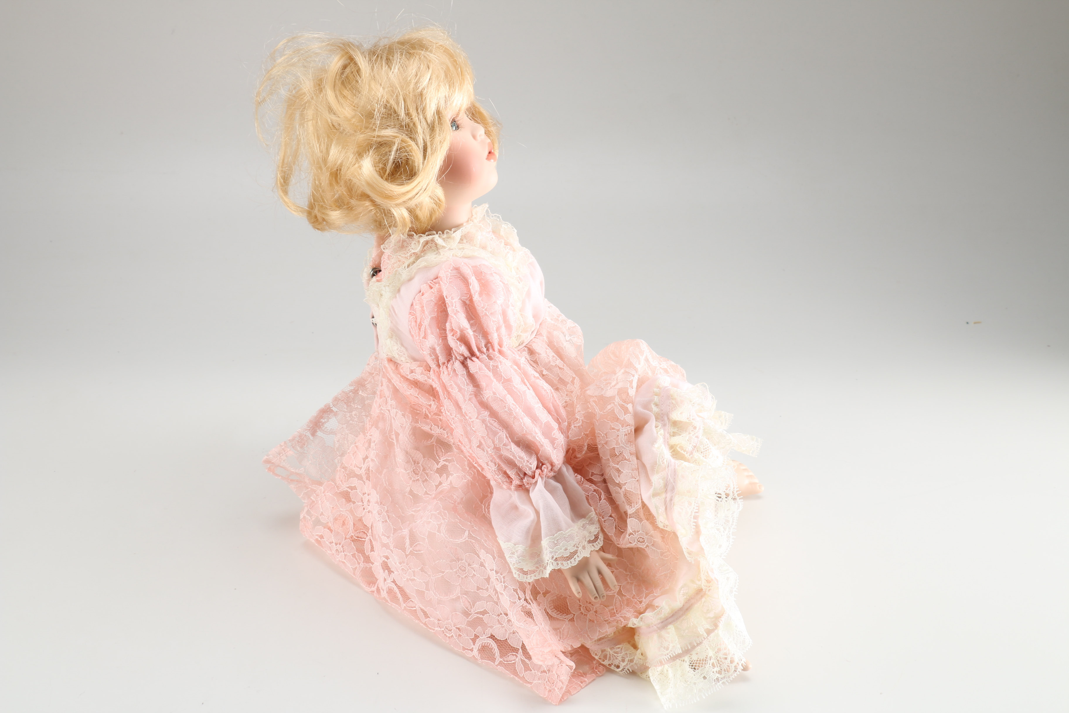 Broadway Collection Seated Porcelain Doll