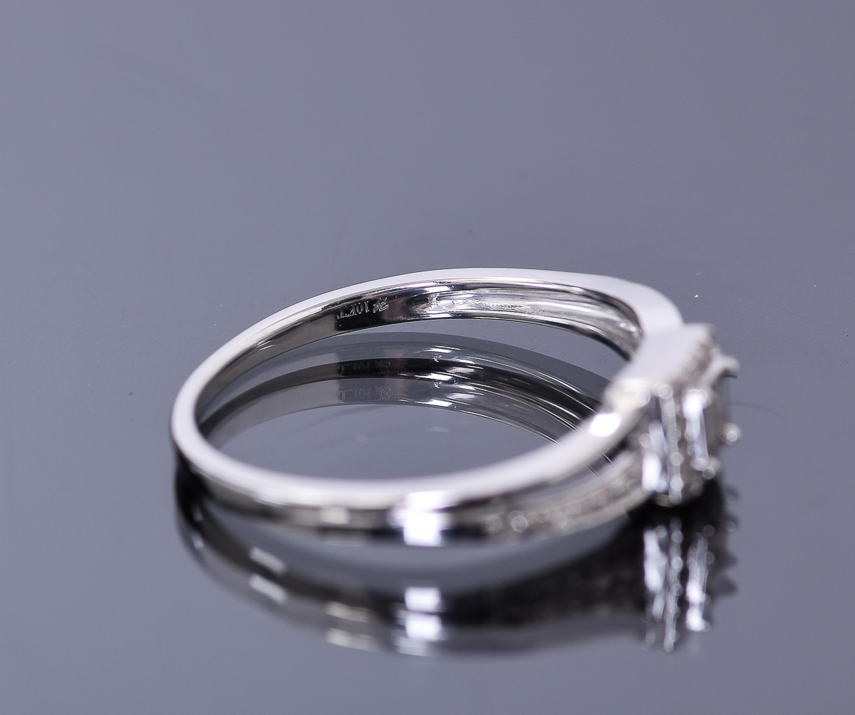 10K White Gold 0.16 CTW Diamond Bridge Ring