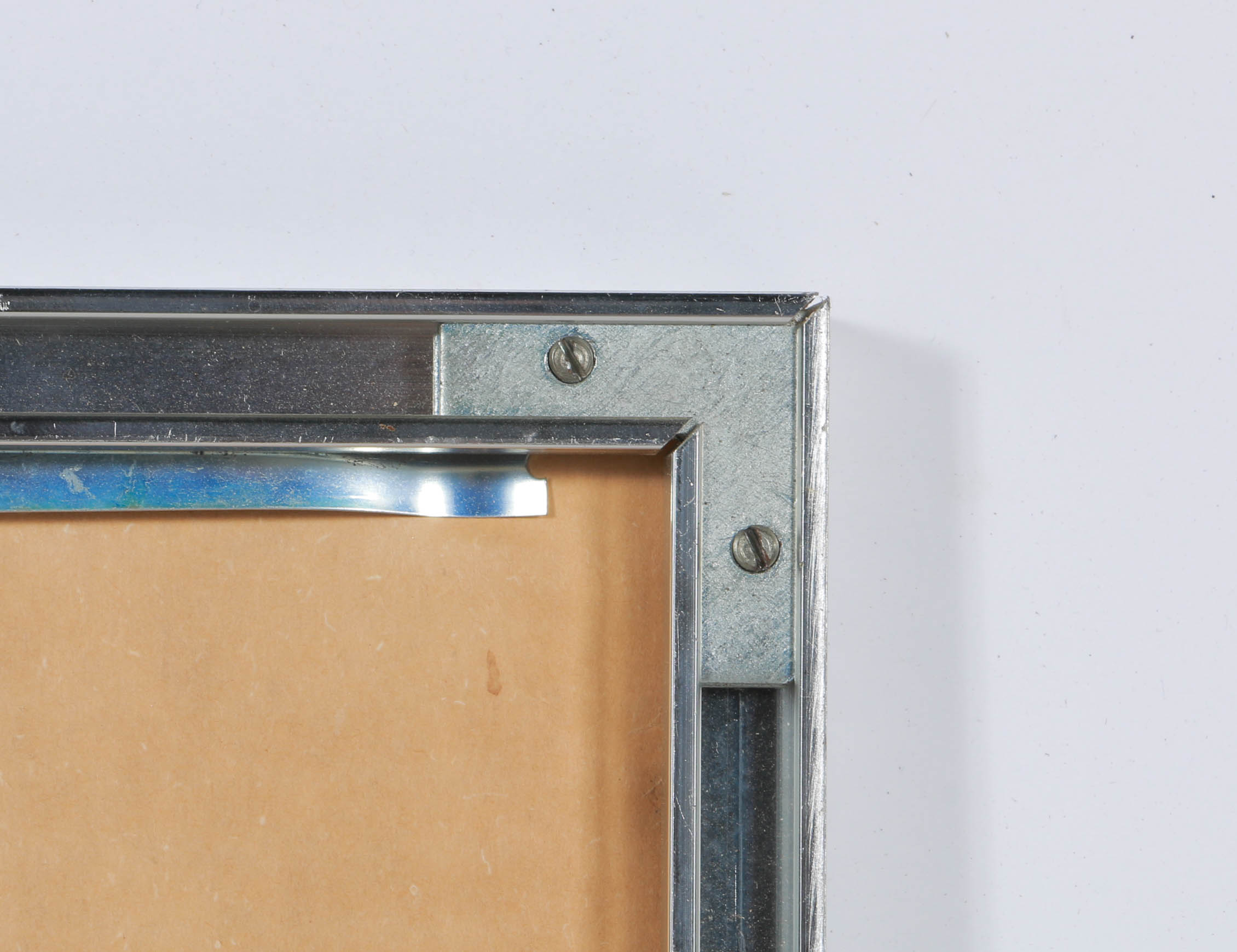 Black and White Photograph of a Nude Figure Under an Arch