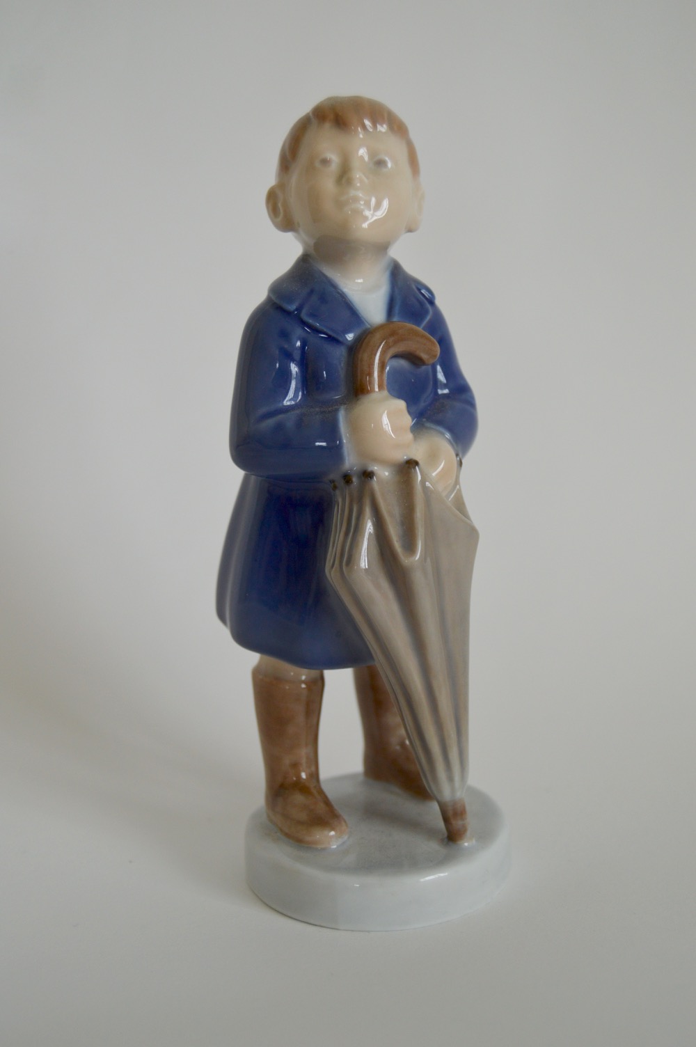 Royal Copenhagen Denmark "April, Boy With Umbrella" Figurine