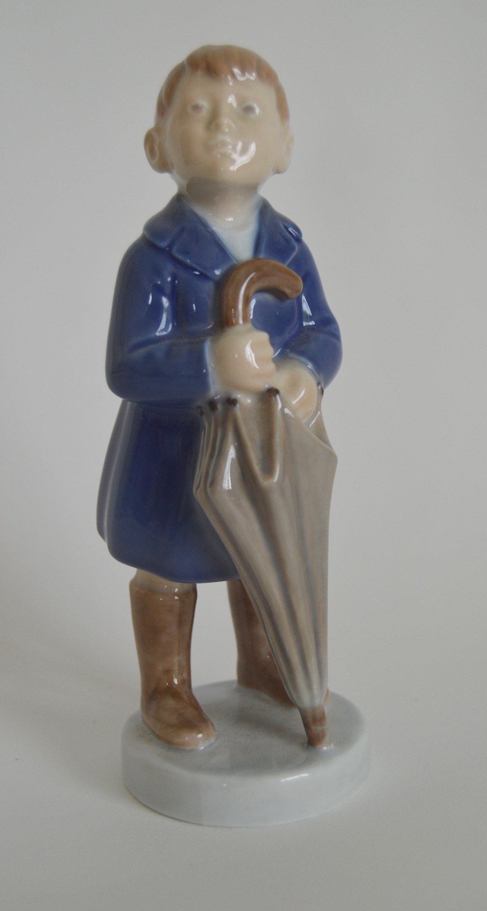Royal Copenhagen Denmark "April, Boy With Umbrella" Figurine