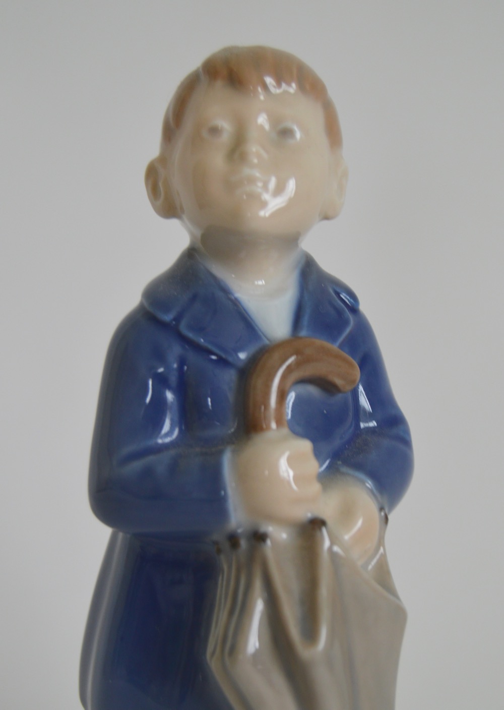 Royal Copenhagen Denmark "April, Boy With Umbrella" Figurine