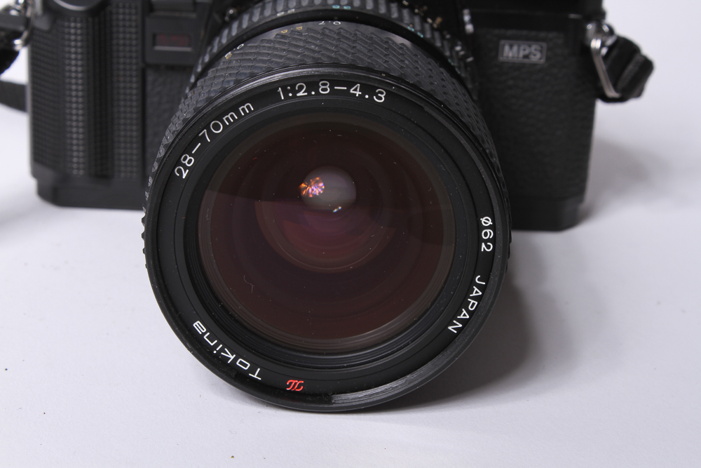 Minolta X-700 SLR Camera With Tripod