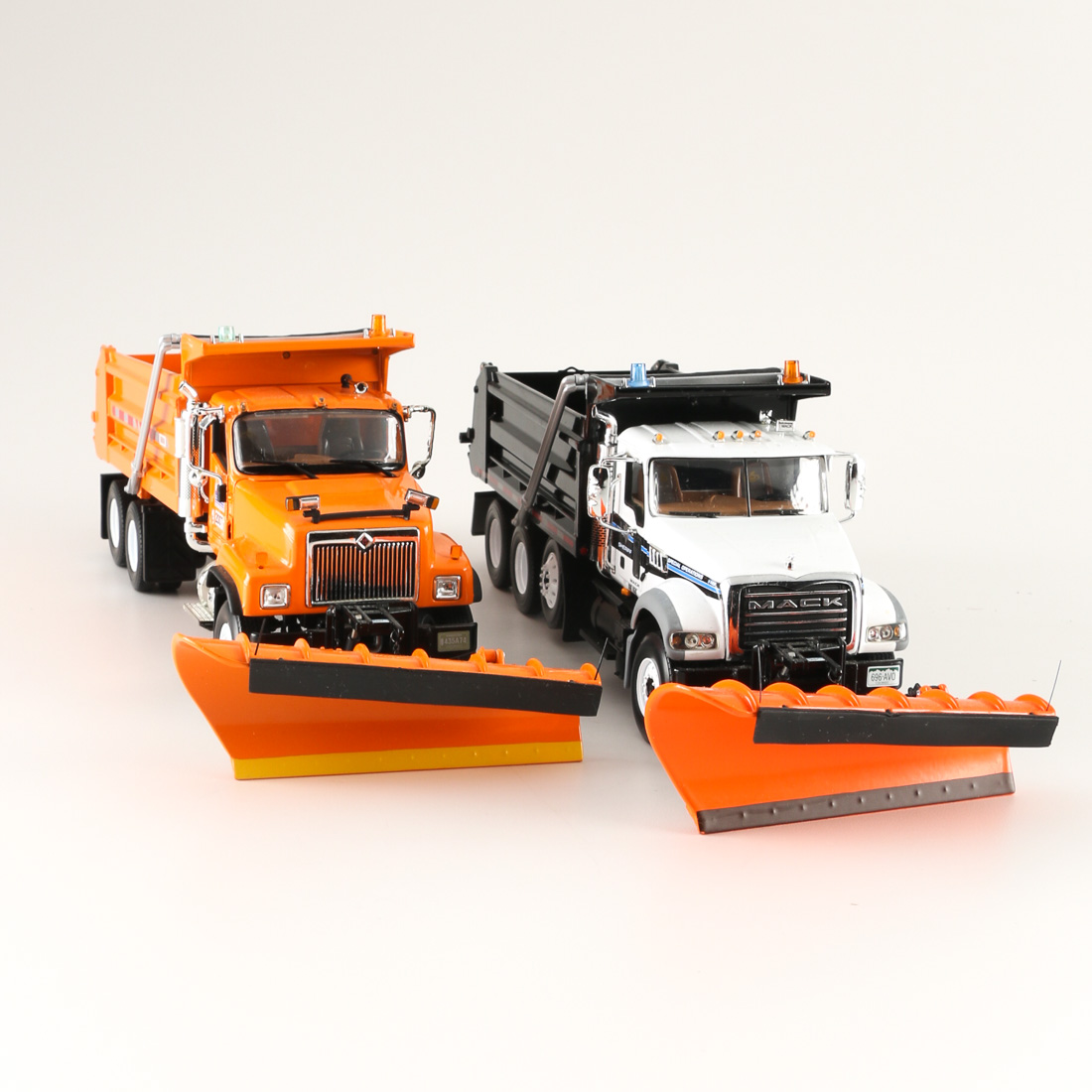 Pair of Die-Cast Dump Trucks with Snow Plows