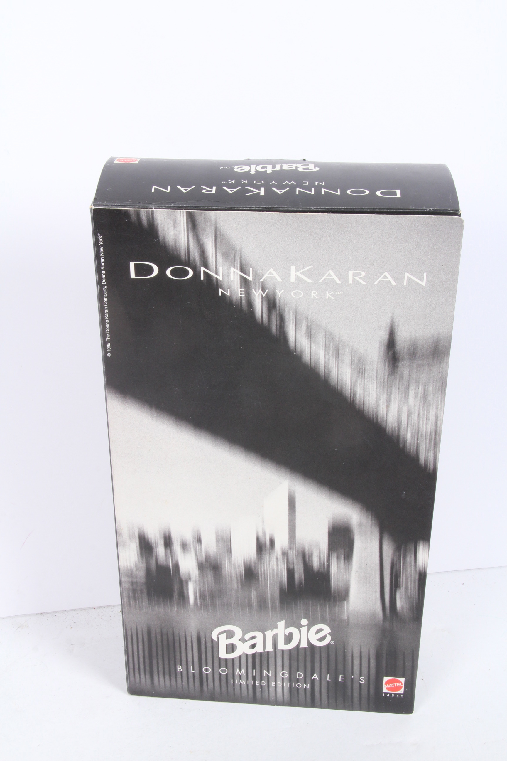 Four Limited Edition Barbie Dolls Designed by Christian Dior, Donna Karan, and Hanae Mori