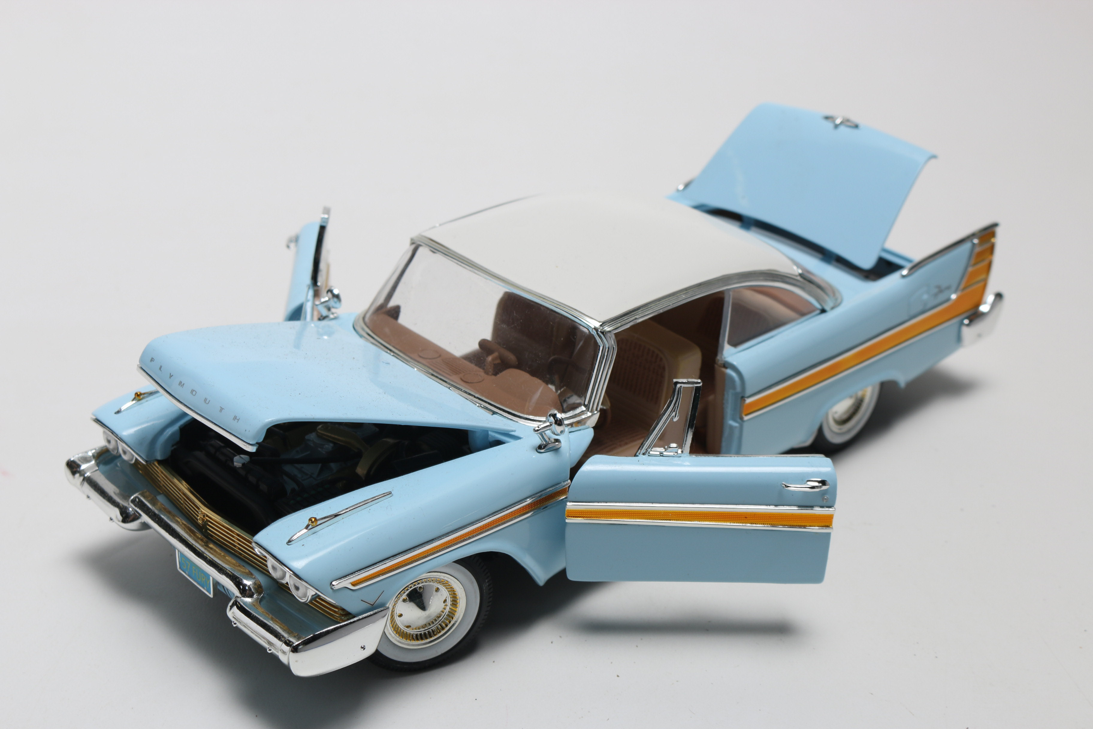 Three Die-Cast 1950s Plymouth Model Cars, One Limited Edition