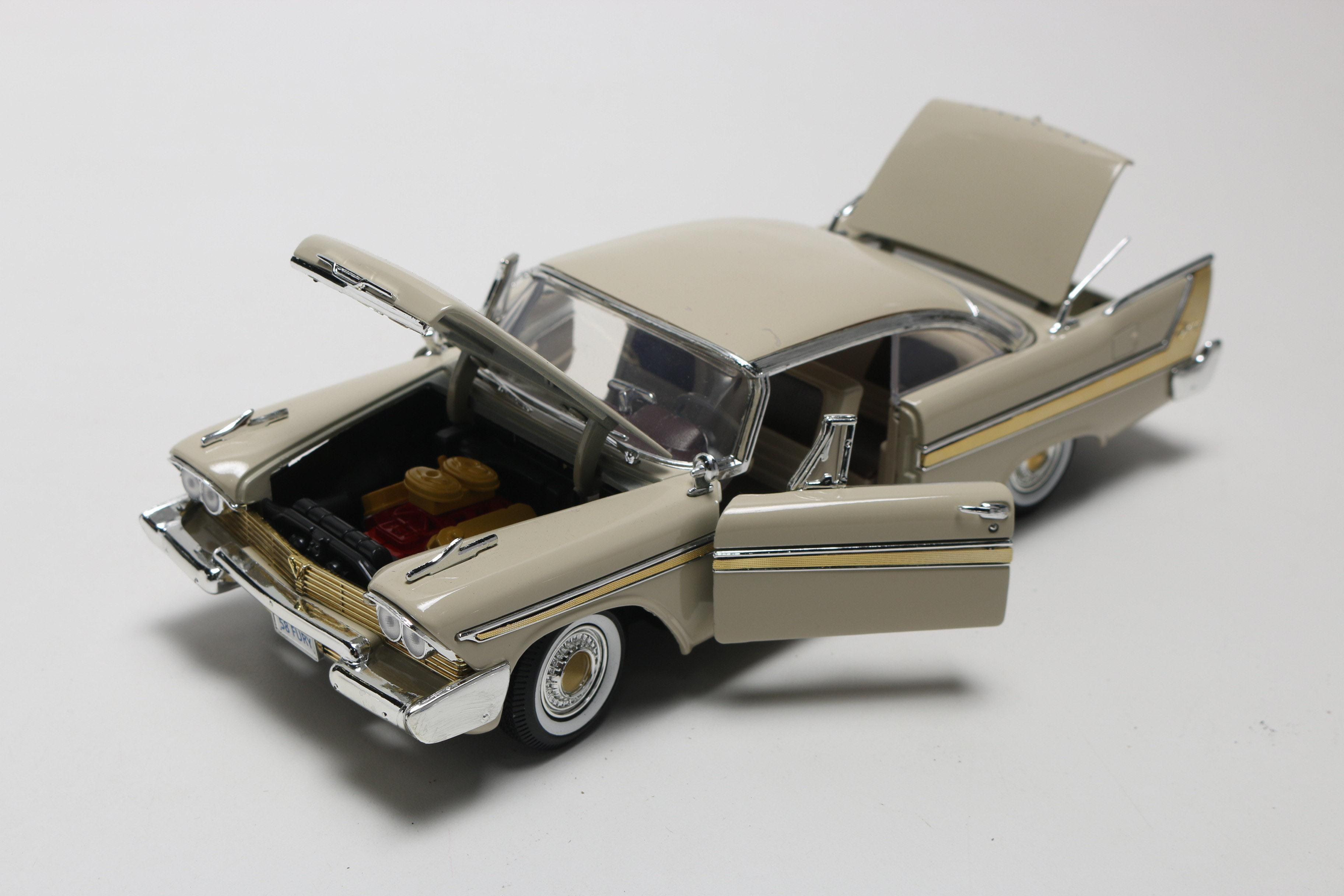 Three Die-Cast 1950s Plymouth Model Cars, One Limited Edition