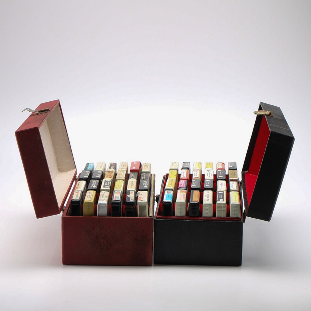 Vintage 8-Track Cassette Tapes with Storage Cases