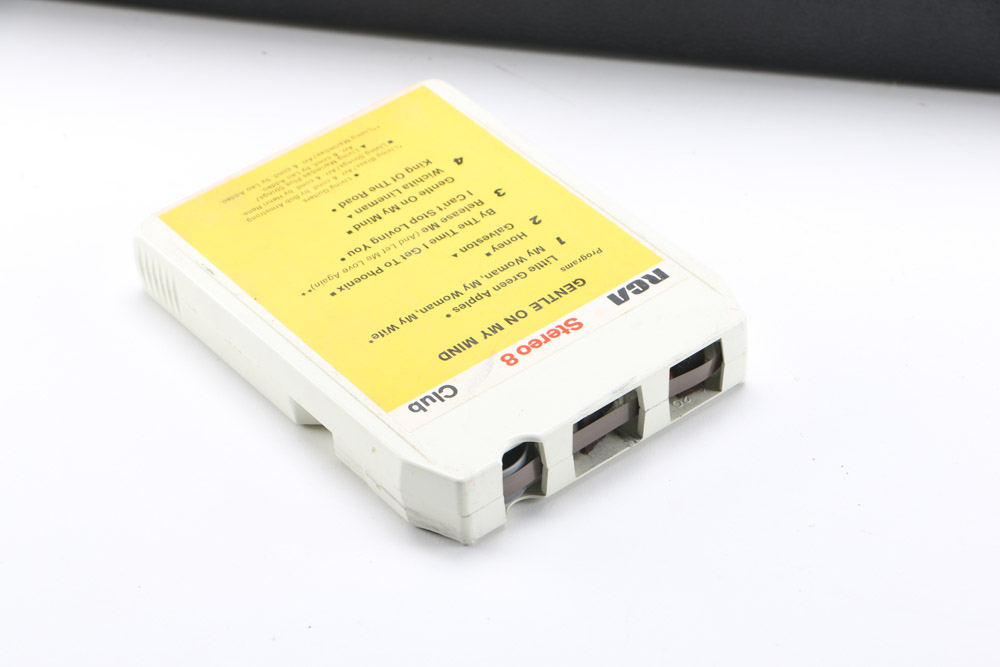 Vintage 8-Track Cassette Tapes with Storage Cases