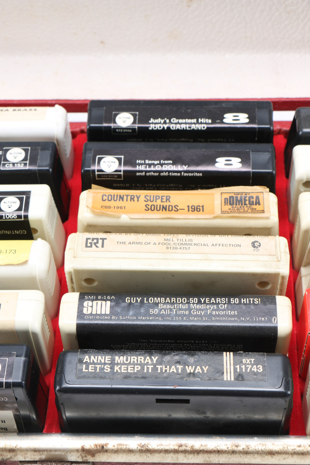 Vintage 8-Track Cassette Tapes with Storage Cases
