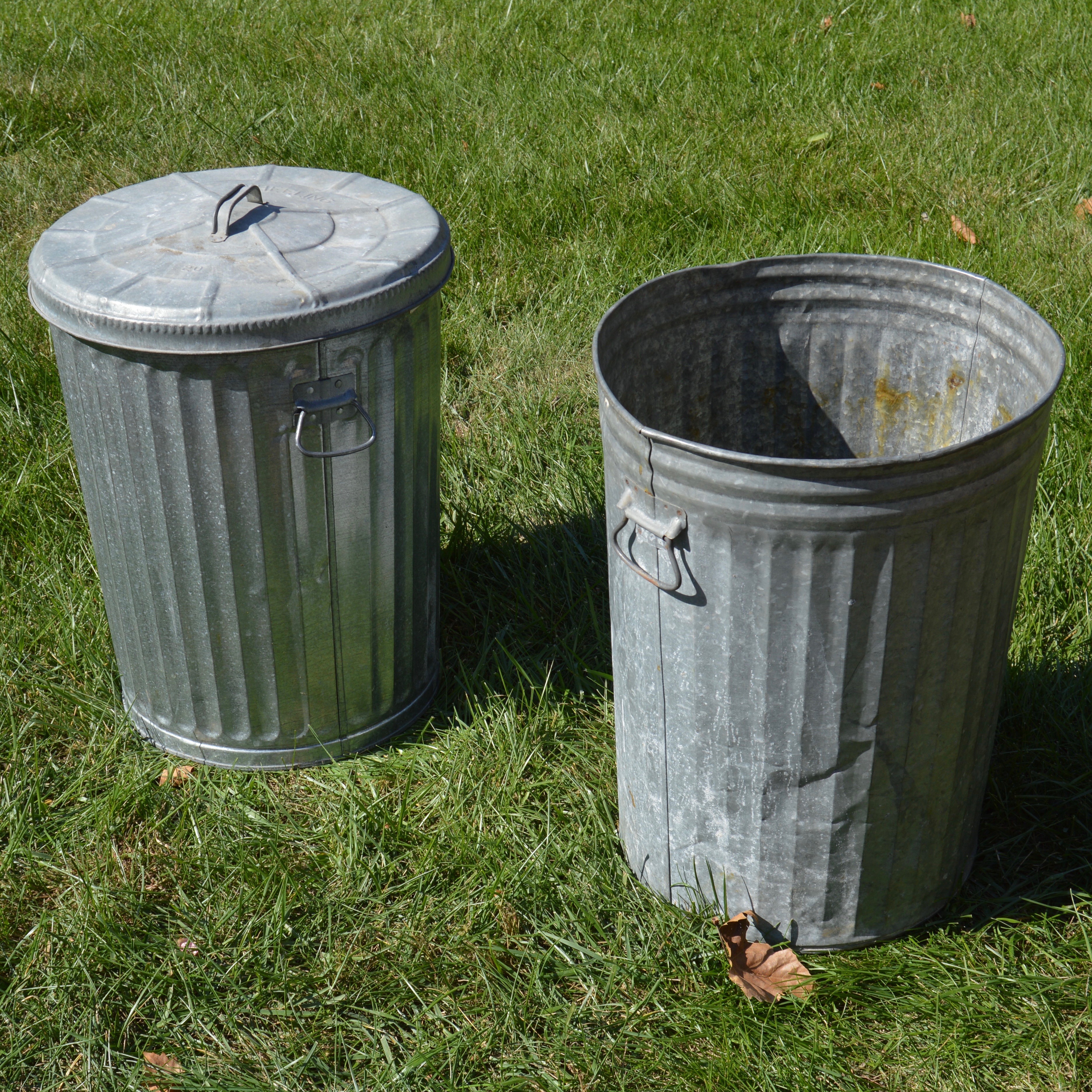 Two Vintage Wheeling Metal Trash Cans