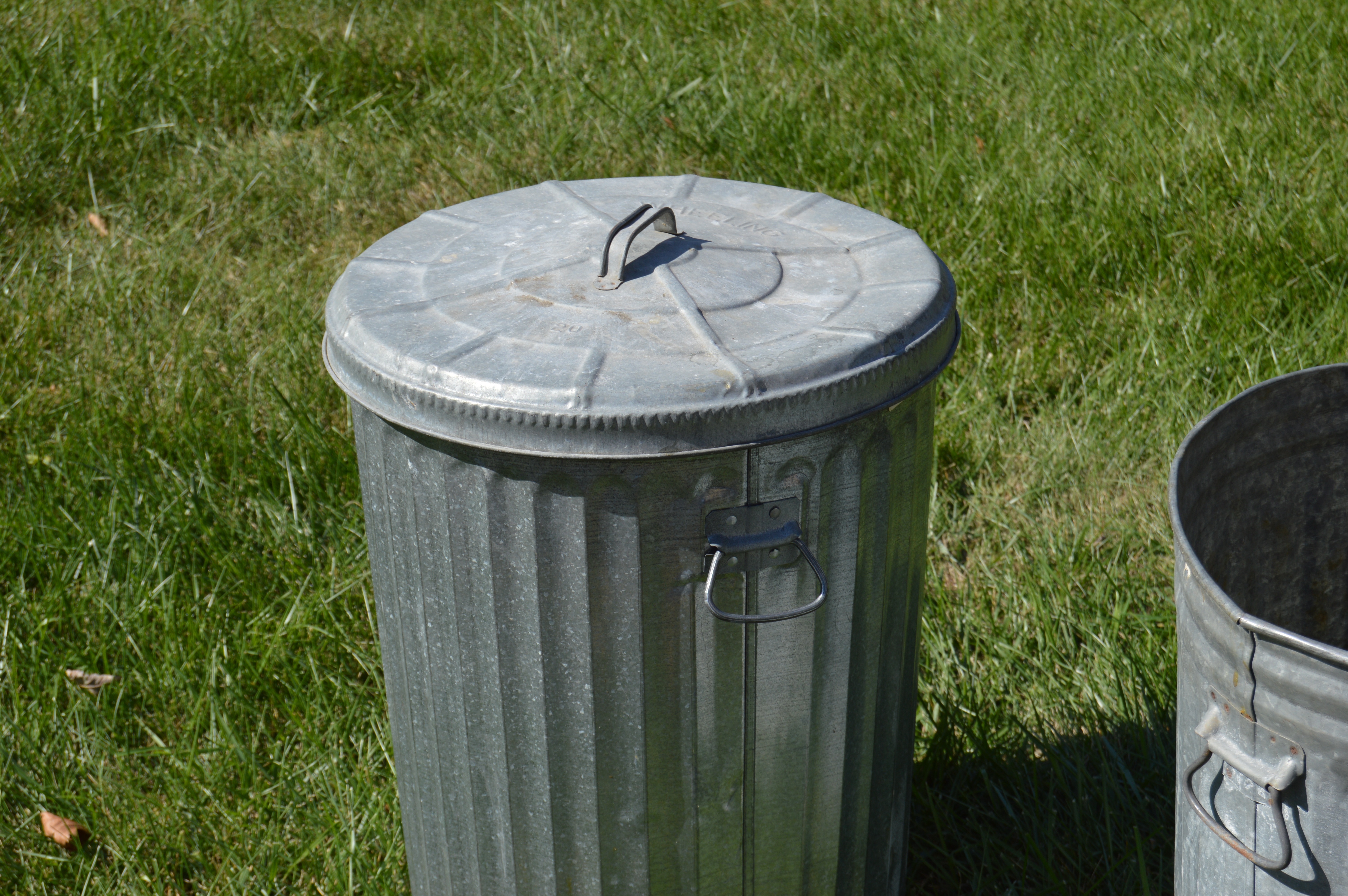 Two Vintage Wheeling Metal Trash Cans