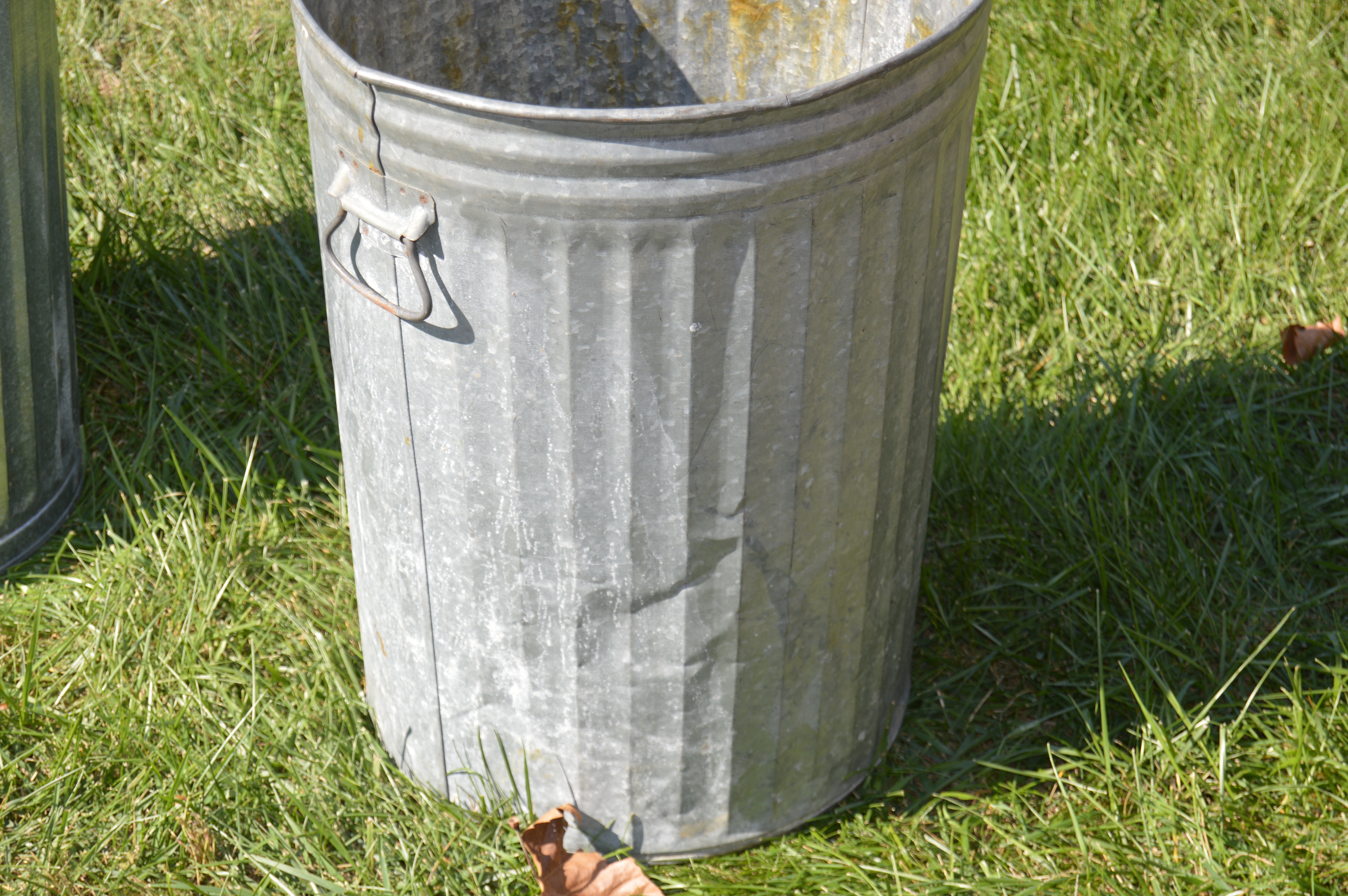 Two Vintage Wheeling Metal Trash Cans