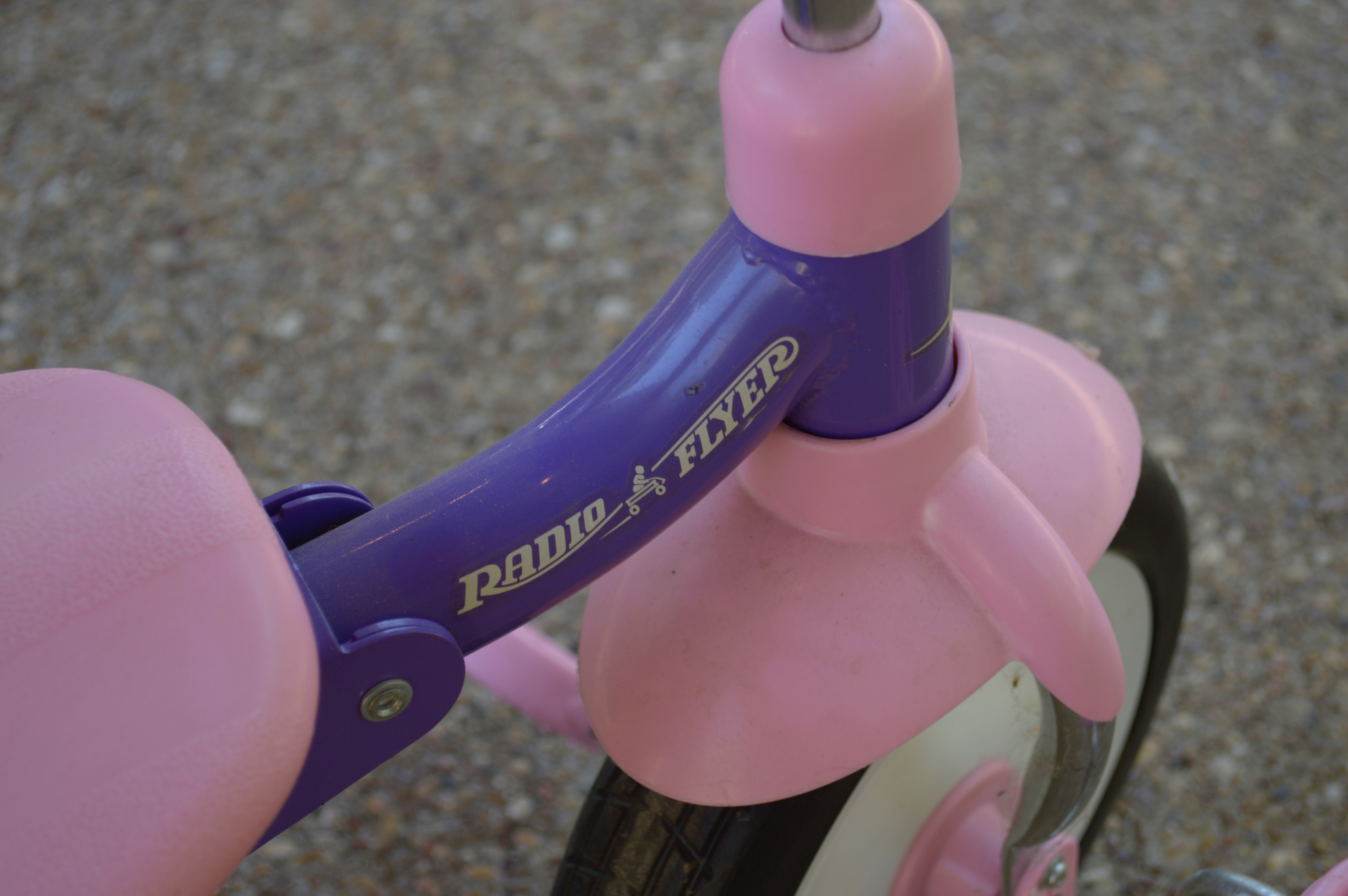 Pink and Purple Radio Flyer Tricycle and Cowgirl Hat