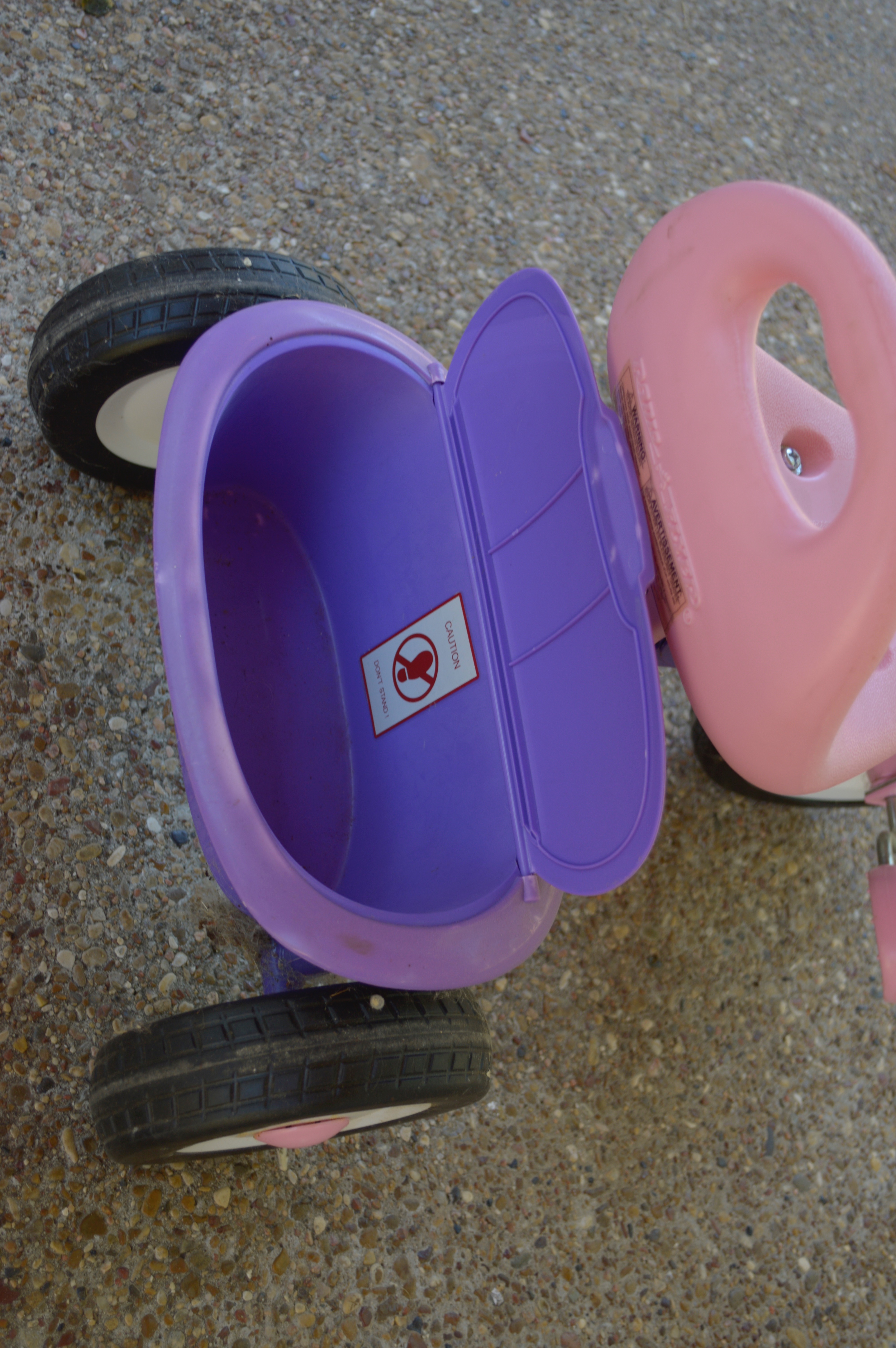 Pink and Purple Radio Flyer Tricycle and Cowgirl Hat