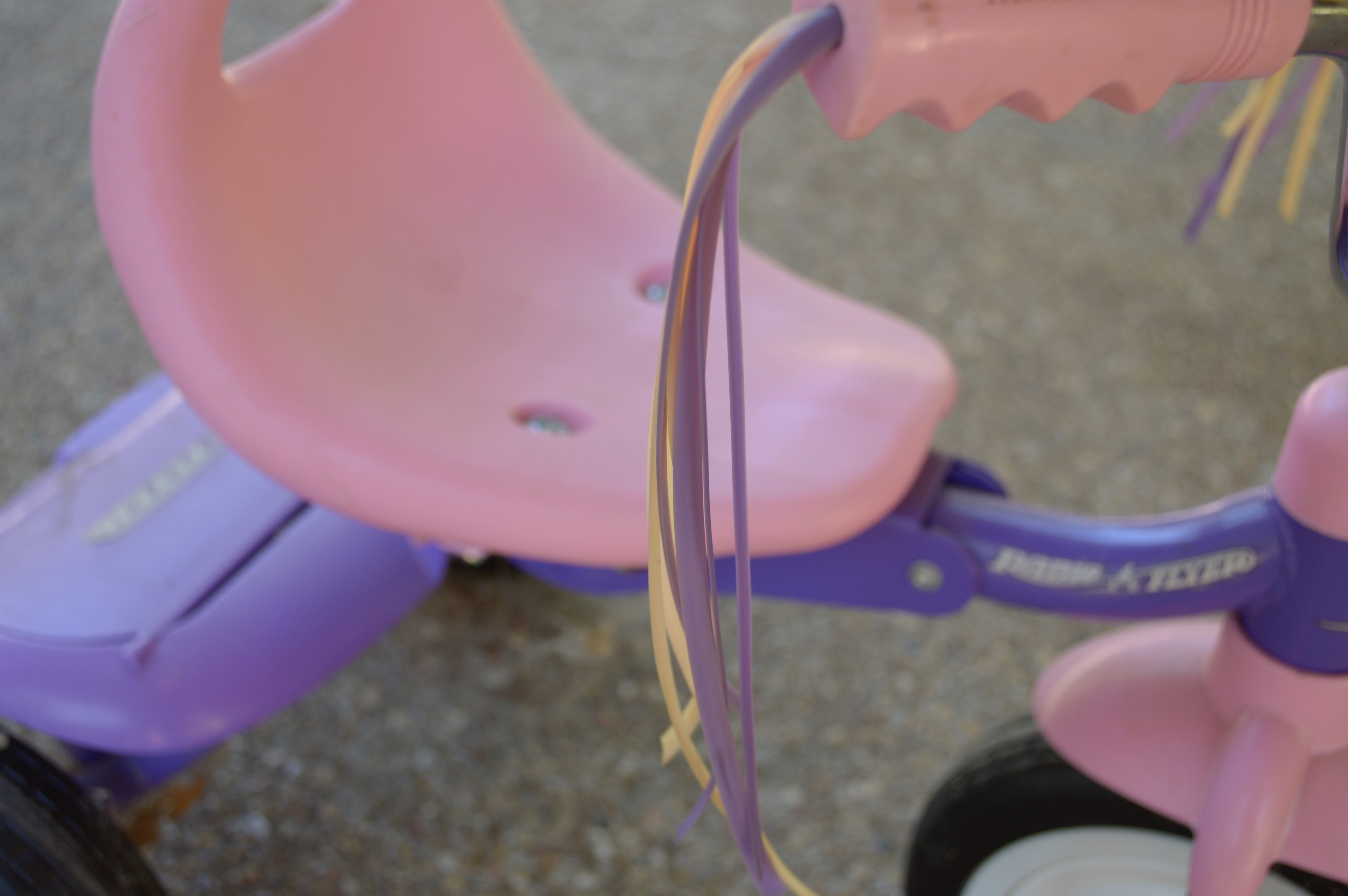 Pink and Purple Radio Flyer Tricycle and Cowgirl Hat