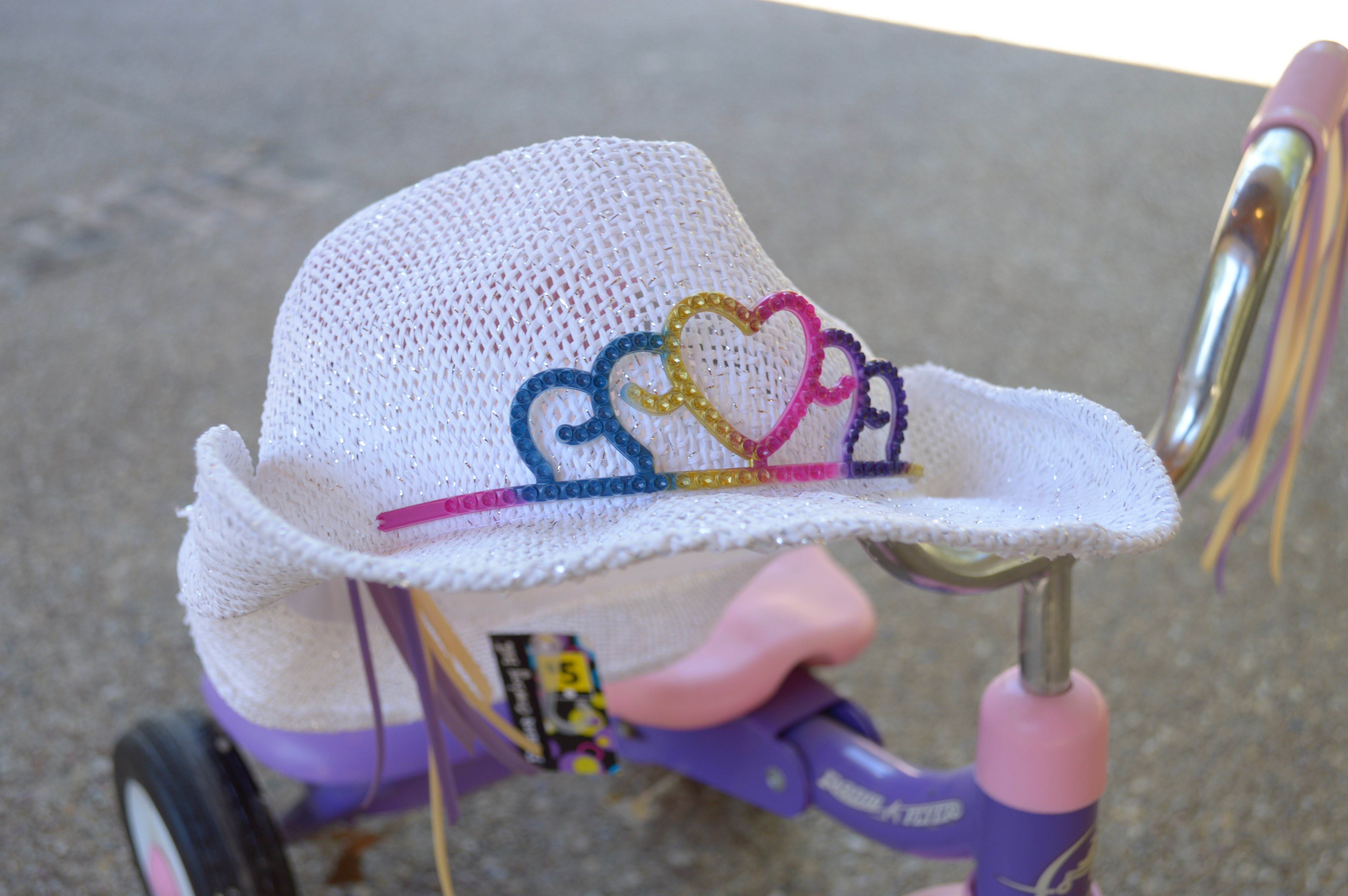Pink and Purple Radio Flyer Tricycle and Cowgirl Hat