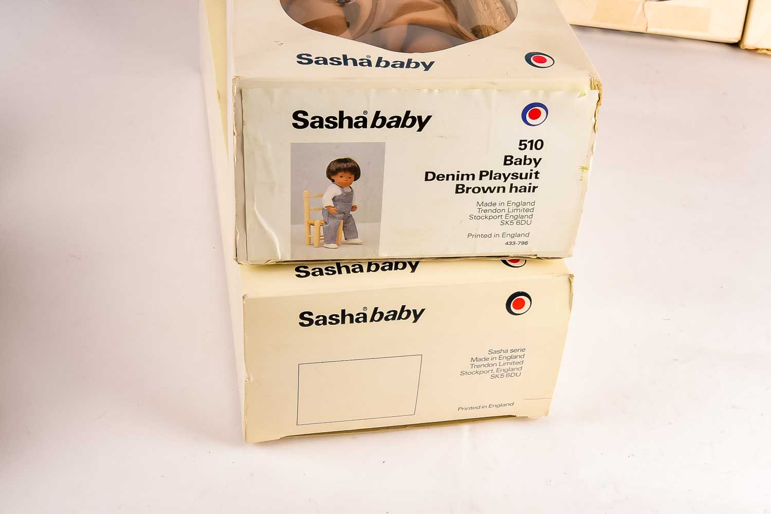 Collection of Eight "Sasha" Dolls, with Doll Trunk and Clothing